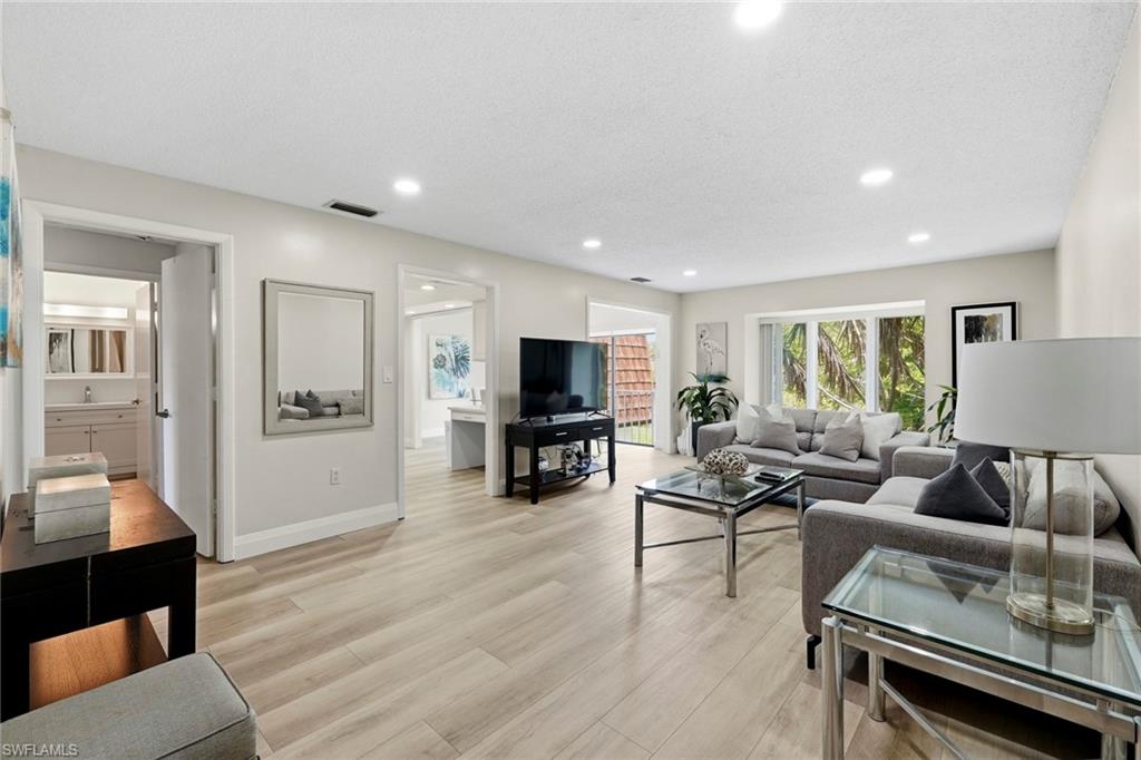 Welcome to your own slice of paradise in the heart of Naples! Nestled within the lush, tropical setting of Naples Bath & Tennis Club. This charming, recently updated, second-floor condo offers the perfect blend of comfort, convenience, and peaceful lakefront living.

Featuring 2 bedrooms, 2 bathrooms, and approximately 1,208 sf of living space, LVP Flooring, new kitchen countertops, backsplash, and updated bathrooms, this bright and inviting residence showcases an open-concept layout, and tranquil water views that create a relaxing retreat from the moment you walk in. Enjoy your morning coffee or unwind at sunset while overlooking the serene lake, surrounded by mature landscaping and abundant wildlife.

Residents enjoy a beautifully maintained community with scenic walking paths, lakes, mature tropical landscaping, and a peaceful atmosphere that feels tucked away while remaining incredibly central. Experience the best of Naples living where convenience, natural beauty, and relaxed Florida charm come together.

Ideally located just minutes from Naples' world-famous white sand beaches, Waterside Shops, Mercato, Downtown Fifth Avenue South, exceptional dining, golf, entertainment, and everyday conveniences, this home places everything Southwest Florida has to offer right at your fingertips. Whether you're searching for a full-time residence, seasonal escape, or investment opportunity, this location is hard to beat…. Capture the Naples Lifestyle!