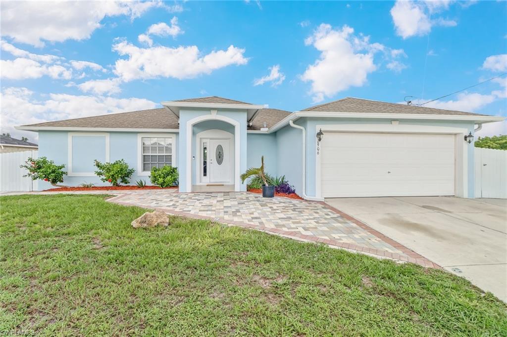 Well maintained 3 bedroom 2 bathroom single family residence located in the up & coming Cape Coral! Enjoy the freedom of living outside the confines of an HOA, while maintaining proximity to what makes the SWFL region such a desirable place to call home. The first eye-catcher is the fresh exterior paint, complemented by pristine white fencing around the perimeter. The extended driveway is perfect for accommodating gatherings of any size, for any occasion. Tile throughout the residence gives for seamless transitions from room to room, while granite countertops  add vibrancy and sophistication to the well maintained kitchen. Access the newly extended back lanai from the master bedroom, and take in the fresh Florida air every morning!