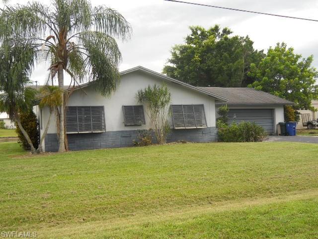 This is a great deal for a home within a stone's through of the Caloosahatchee River on a deep water canal - the Gulf side of the Locks as well. House has 3 bedrooms, 2.5 baths and sits on almost 1/2 acre of land. 1617 square feet of living large so close to the river, hanging on your screened lanai or lounging on the canal with a fishing pole in your hand. Both bathrooms have been updated with wood cabinets and solid surface countertops and the master has a brand new shower with glass walls and new tile in the second bath shower/tub as well. This home is ready for your personal touch and then live the life of your dreams on the water.