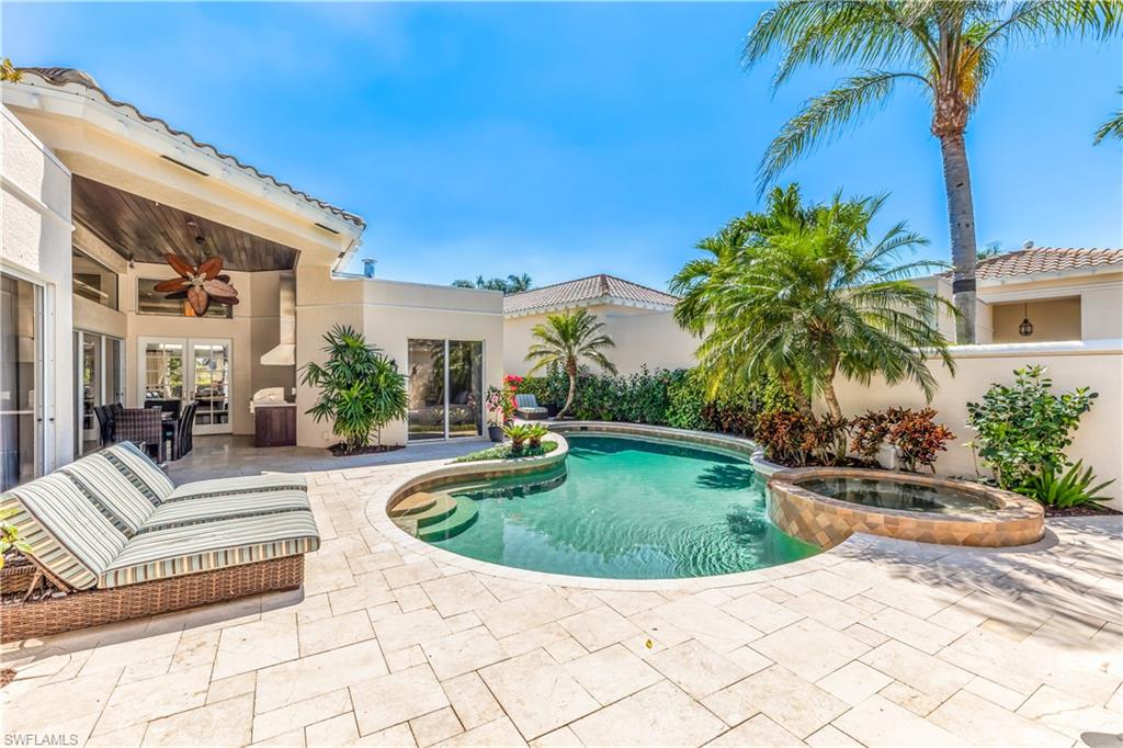 This masterfully designed One-Of-a-Kind, Aruba Model Villa was meticulously renovated by BCB Homes into a Timeless Elegant Coastal Jewel. Beautifully blended sophistication with elegance, only with the finest of quality and craftsmanship. It’s like no other, simply breath-taking. Marble cream flooring, warm colored walls, high volume ceilings with massive beams give boundless spacious feel to this stunning bright and airy residence, unique huge chandlers, ensuite baths all with custom granite and designer plumbing fixtures, the chiefs gourmet kitchen boasts of white shaker style custom cabinetry, designer appliances, a gas stove. The covered outside courtyard gas built-in stainless steel barbeque kitchen is fabulous. This Rarely available Villa is uniquely situated on the Pelican Bay Golf Couse, offering southern exposure with backyard privacy from its bougainvillea trellis covered patios but with phenomenal long golf course and lake views, and fore you golfers it’s about  a 9 iron from a golf green. For the gardeners enjoy the citrus and banana trees in the backyard and maybe add herb garden. This gemstone residence offers the opportunity to purchase one of the most prized villas in Naples that simply offers everything to the most discriminating.