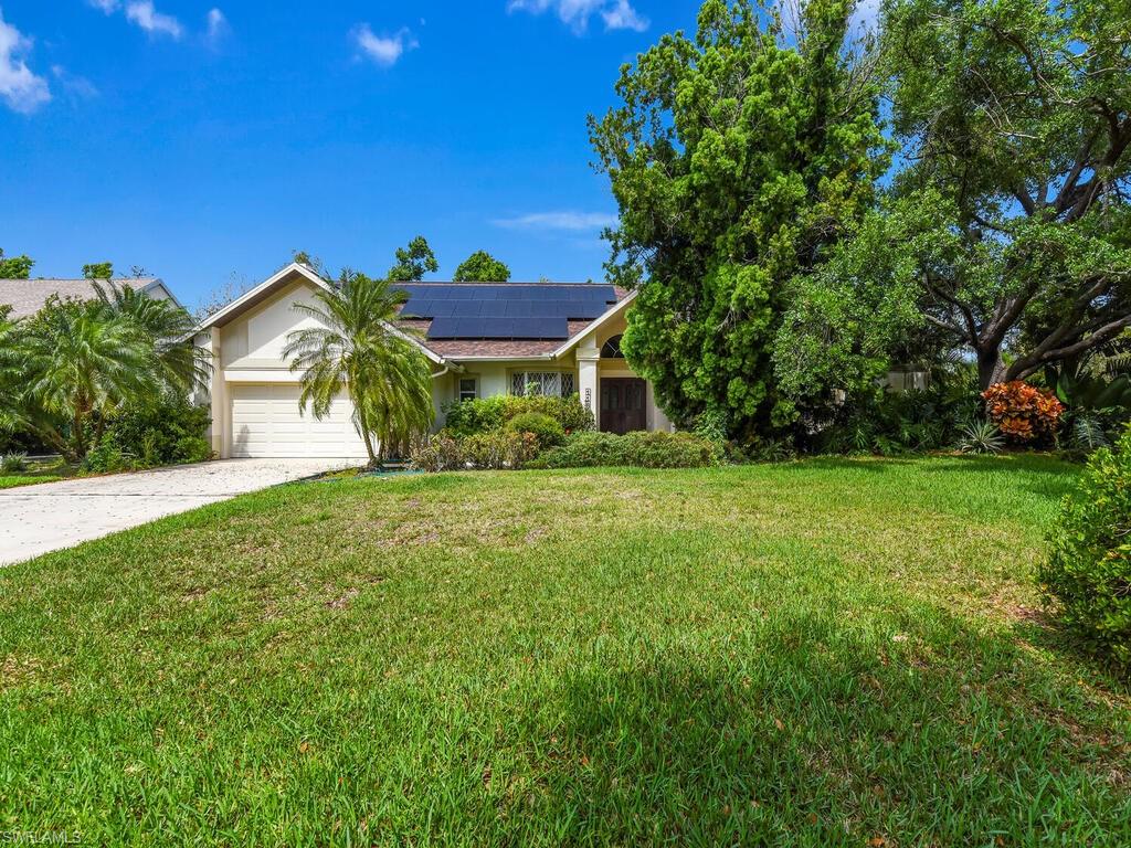 Beautiful property located in the popular Timbers gated community in the heart of Ft. Myers! The feeling of being away from it all, yet so close to so many restaurants and off of Colonial Ave. This sprawling 4 bedroom, 2.5 bath ranch home with over 3300 square feet of living is the perfect place to call home. Roof is less than a year old (2023) with whole house solar panels! The kitchen was remodeled to add a huge island perfect for entertaining overlooking the oversized family room with vaulted ceilings and a wood burning fireplace. As you walk through the double front doors, you enter the formal living and dining rooms with the master just to the right, and the other 3 bedrooms located on the opposite side of the home. Step outside to the oversized lanai and pool with huge covered patio. This is a home you do not want to miss!