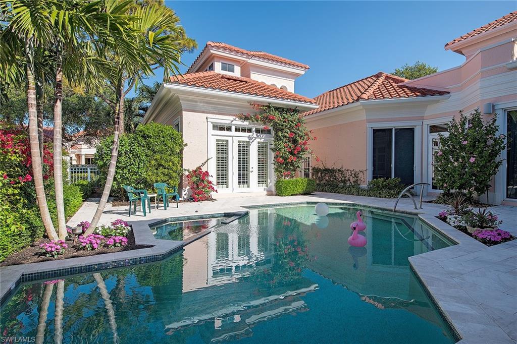 Rarely available Isle Verde courtyard home overlooking the third hole of the Bay Course at Pelican Bay. Beautiful views of the golf course and lake from a large terrace. Pet-friendly neighborhood. Can have two pets any size. Three bedrooms and a den with three-and-a-half baths. 3,620 square feet under air. Includes a charming guesthouse with en-suite bath and morning kitchen. Custom-designed kitchen renovated in 2007/08 with high-end cabinetry and beautiful granite countertops. Appliance package includes convection double ovens. Master bath was renovated in 2011. This home has very high-end finishes throughout: woodwork, moldings, cabinetry, wood floors and carpeting, all are beautifully done. Enjoy the private pool and spa with large patio for lounging. Roof was replaced in 2018. Hvac 2016/17. New skylight in the master bath. Secure environment with 24-hour manned gatehouse. Pelican Bay offers almost 3 miles of private beach with two beach restaurants (destroyed by Hurricane Ian and being rebuilt). Two tennis centers, a state-of-the-art fitness center, bike and walking paths, kayaks and canoes.