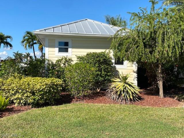 Lot 80. North facing lot. Waterfront. Lovely location in the center of RiverBend MotorCoach Resort. Coach house on site is a 16'x24'. The coach house has glass french doors with built in blinds for privacy. There is a kitchenette with stainless refrigerator. Front loading washer/dryer located in storage/closet area. Bathroom has tile and a glass walk-in shower. Waterside lanai features pavers. Wood inlay ceiling. Riverbend is a golf cart & pet friendly community on the Caloosahatchee River with a private boat ramp, large pool, bocce, shuffleboard, putting green, horseshoes, hot tubs, clubhouse, covered picnic area, exercise room and community laundry room. 8 Pickleball courts open year round. R/C racetrack, hobby train under the oaks, billiards, R/C boating club and more.