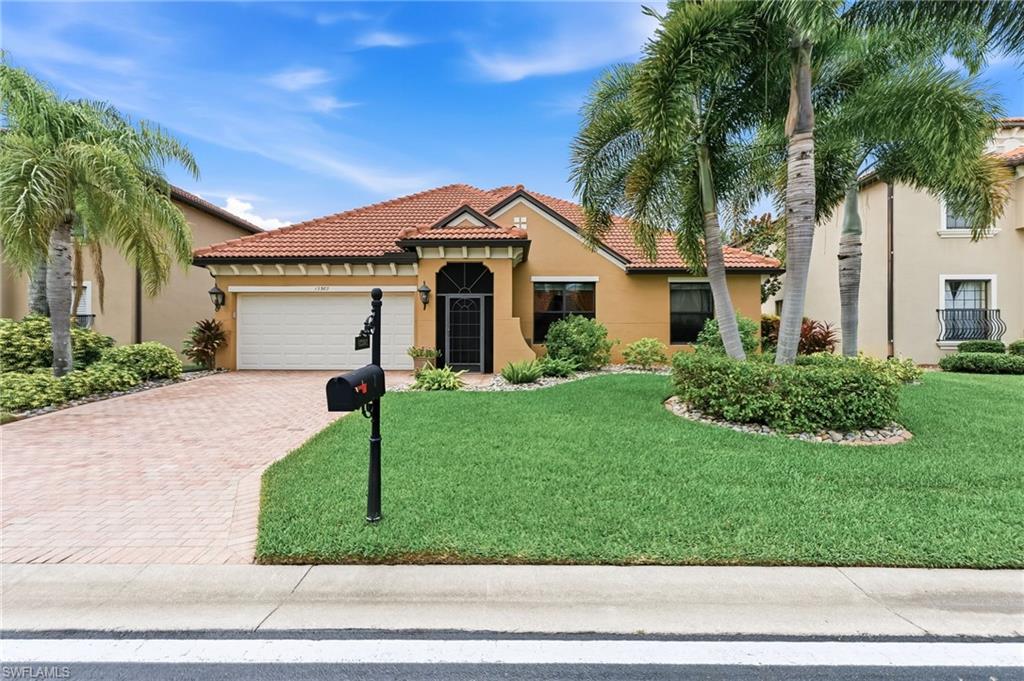 The spacious open floor plan features generous living areas filled with natural light, complemented by updated designer lighting in the living room, dining room, and kitchen. Plantation shutters throughout add classic elegance and privacy, while the well-appointed kitchen opens to the main living spaces, creating the perfect gathering place for family and friends.

Upstairs, you'll find an oversized bonus room offering incredible flexibility. Whether you're looking for a recreation room, media center, game room, or a potential fifth bedroom, this versatile space includes a walk-in closet and adjacent full bath, making it ideal for guests or multi-generational living.

Step outside to your private backyard oasis, where you'll enjoy tranquil pond views from the expansive lanai featuring a stunning wood-paneled ceiling. The fully equipped outdoor kitchen makes entertaining effortless, while the saltwater pool, heated by both solar and electric pool heating systems, provides year-round enjoyment.

Built for both comfort and peace of mind, the home features impact-resistant windows, steel roll-down storm shutters across the entire rear of the home, a new tile roof (2020), upstairs HVAC (2018), and downstairs HVAC (2023).

Combining luxury, thoughtful upgrades, energy efficiency, and breathtaking waterfront views, this move-in-ready home offers the very best of Southwest Florida living. From its flexible floor plan and resort-style outdoor living space to its extensive improvements and meticulous maintenance, this exceptional property is truly one you won't want to miss.
