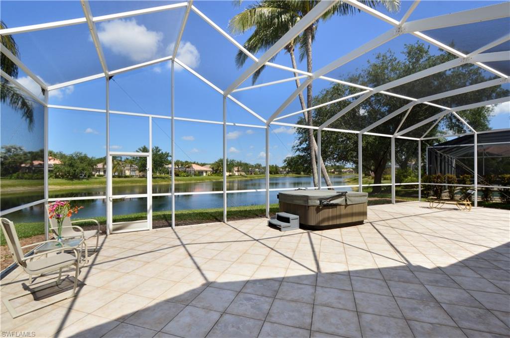 Don't miss this lowest-priced DiVosta poured concrete Carlyle, Island Walk's largest floorplan! This immaculate home has an extraordinarily LONG and wide lake view, and you'll never tire of the spectacular Naples
sunsets over the shimmering water. Other sought-after features are excellent proximity to the gate so you don't have to drive all around the community to come or go, and this is one of the newer Carlyles in Island Walk! This pristine home boasts all large tile flooring since newer (no carpet to replace!), electric storm shutters, plantation shutters, air conditioning & water heater replaced in 2016, renovated tiled master bath shower, Corian counters that look brand new, and crown molding throughout the home for that perfect finishing touch. A one-year home warranty is being offered to the lucky purchaser! Don't miss the Town Center with unbelievable amenities/conveniences, such as separate lap and family pools, poolside restaurant, huge fitness center, tennis, gas station, post office and much more! No reason to need to pay to maintain a pool at your home with the two at the Town Center - just enjoy your Jacuzzi tub on your extended tiled lanai as you watch the sun set!