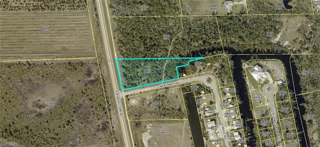 Commercial lot on Stringfellow Rd In St James City on Pine Island. Uncleared  1.81 Acres total, C-1 commercial zoned. 
Pine Island is the Largest Island in Florida and is surrounded on the East by Cape Coral/Ft Myers and to the west by Sanibel/Captiva and the outer Islands...Tropical Island Main Road visibility - Great future growth potential and at this Great Price  !!!! There are two other parcels listed that are contiguous to this parcel for a total of 9 acres (2026024006 & 2026024007) Bring your sunglasses & sun tan lotion and check out this 5 Acre Commercial property TODAY.