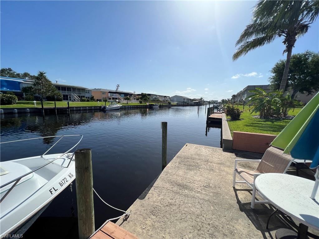 NO DAMAGES FROM HURRICANE IAN! Welcome to the Coral Villas Condo in beautiful Cape Coral, FL! This remarkable 1-bedroom, 1-bathroom 1st floor unit offers an exceptional opportunity for those seeking a waterfront lifestyle. With its community boat dock, swimming pool, and gulf access via a saltwater canal, this condo presents an irresistible blend of convenience, recreation, and serenity. One of the standout features of this property is its fantastic location on a saltwater canal with gulf access. Boating enthusiasts will appreciate the convenience of the community boat dock, which offers access to the Gulf of Mexico, and great fishing! Conveniently situated within walking distance to shopping and restaurants.  Don't miss out on the best deal in Cape Coral! Whether you're searching for a full-time residence, a vacation getaway, or an investment opportunity, this condo is sure to exceed your expectations. Schedule a showing today and seize the chance to make this exceptional property yours.