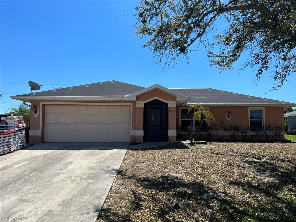 Welcome Home! This Three bedroom, two full bathroom house has been meticulously maintained and renovated.   Wood Plank patterned tile through the main living areas and brand new carpet in the bedrooms. and a brand new roof is currently being completed (Dry in approved_ shingles are being installed.), Vaulted ceilings in main living area and decorative crown molding throughout.   Spacious Master bedroom with en suite bath included a large walk-in closet and Laundry drop directly into the laundry room,  Ceiling fans in every bedroom.  Granite countertops through out including the island, Mostly fenced backyard with plenty of room to play or just enjoy the Florida sunshine.   Mature trees and landscaping complete the view!  Additional pavered patio to relax, grill, or set up a play area.   Great location close to schools, shopping, and entertainment and a short drive to downtown Fort Myers or Downtown Cape Coral.  Home will not last!
