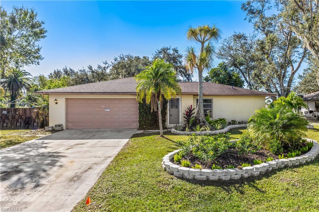 An amazing opportunity to own a single family home in the charming Northeast Fort Myers area across from the Caloosahatchee River in the Paradise Shores subdivision on a  cul-de-sac. The lot offers privacy and NO HOA fees. This home offers 2 bedrooms, 2 full bath, 2 car garage, and screened in patio. All NEW flooring, paint, fans, doors and updated bathrooms. Fresh tasteful landscaping was just put in. This neighborhood is conveniently located near shops, restaurants, and 20 minutes to Downtown Fort Myers.