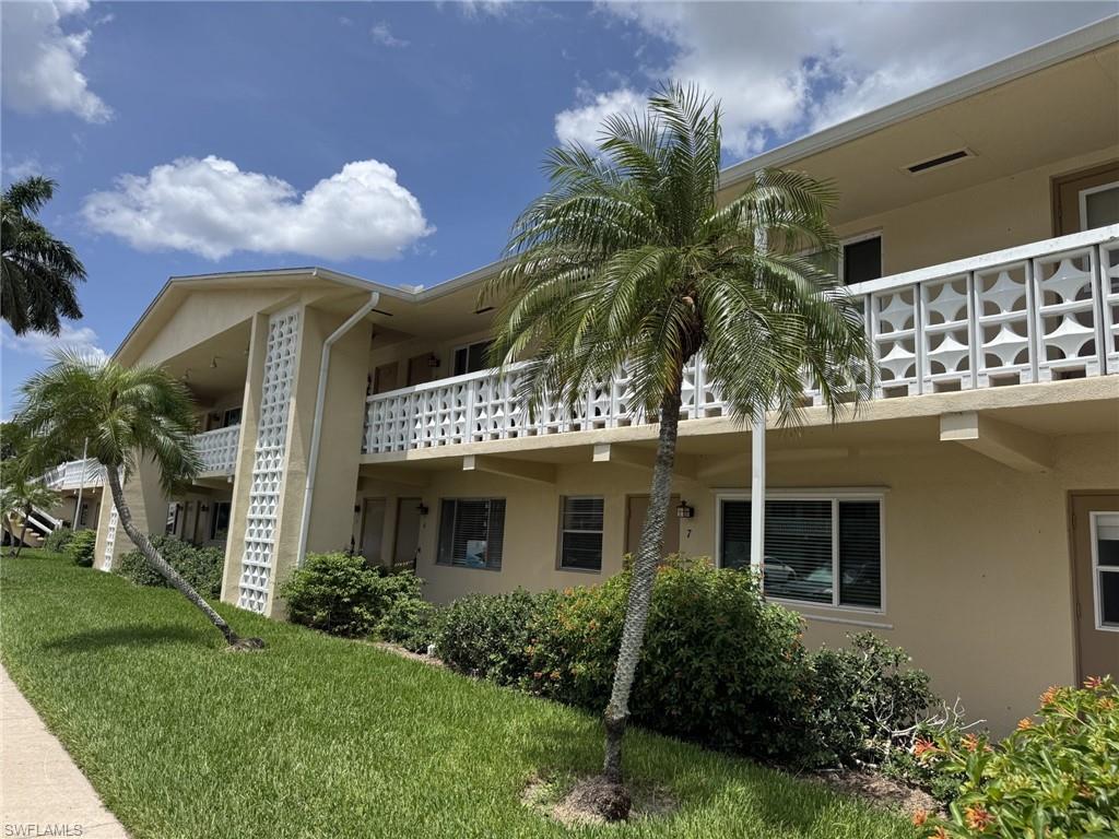This is a wonderful 2 bedroom plus sunroom/den, 2 bath with laundry inside the home.  You will love the huge living room, large dining room, kitchen with separate entrance and lots of cabinets/counter space. The current owner says the power bill has never been over $75. Both bedrooms have large closets and each has a second closet in the sunroom area.  There are hurricane impact windows, tile floors throughout, crown moldings and so much more.  The air conditioning and heating are brand new and the roof on the building is about 2 years old. This building has never flooded. It doesn't get any better than this at this price!