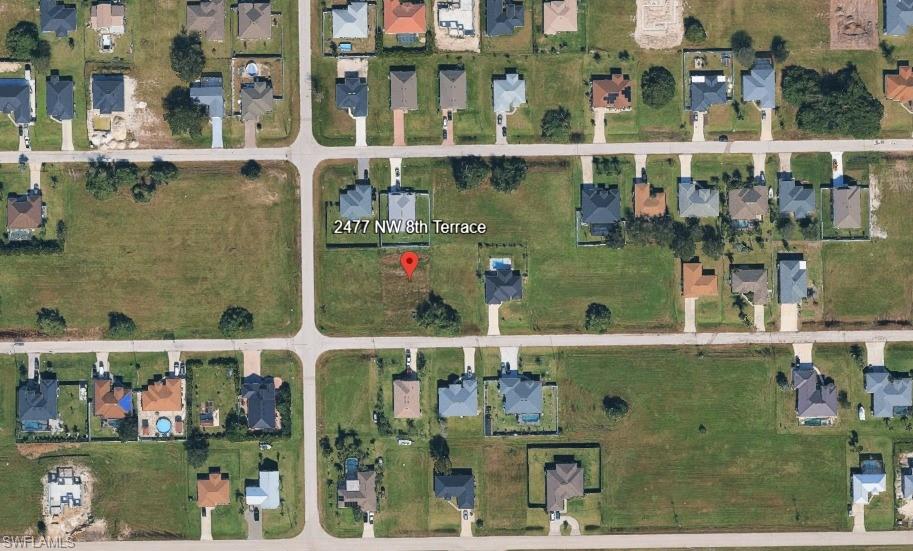 Seller financing available: 25% down, 10% interest, 3-year term with balloon payment; buyer responsible for taxes, closing costs, and maintenance. Build your future home on this desirable standard-sized vacant lot located in the fast-developing area of Northwest Cape Coral. Offering northern rear exposure, this property is ideal for consistent shade in the backyard during the summer months and perfect for those who prefer cooler outdoor living spaces. Situated within North 4 of the Utilities Expansion Project, with city water and sewer installation planned (dates TBD), this lot presents excellent long-term potential for homeowners and investors alike. Surrounded by ongoing development and conveniently located near parks, schools, shopping, and dining, this homesite offers both value and opportunity. Whether you are looking to build now or hold as an investment, this is a fantastic chance to secure property in a thriving and sought-after area of Cape Coral.