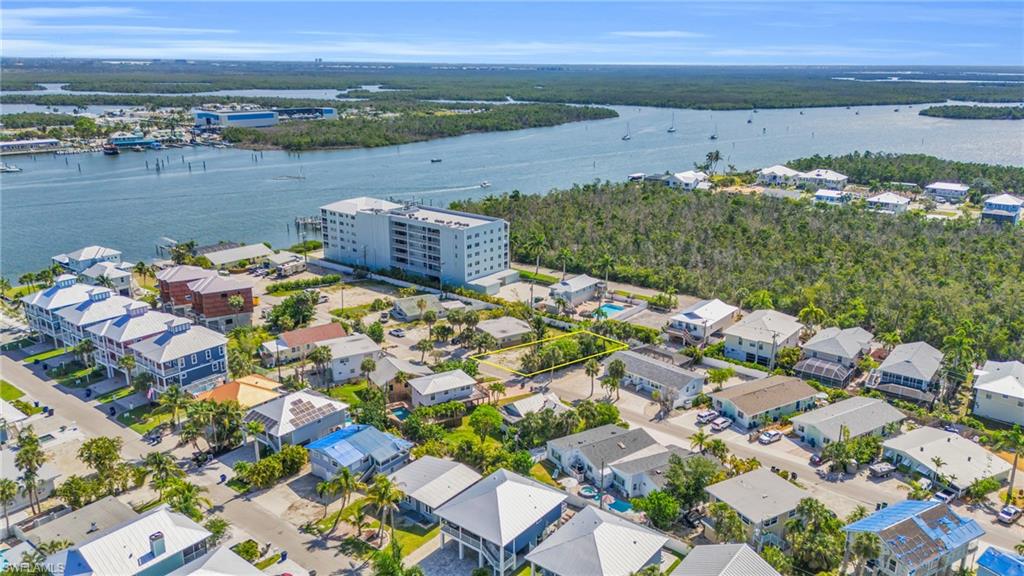 PRIME VACANT LOT IN WEEKLY RENTAL ZONE!!! – Fort Myers Beach This ideally located vacant lot offers a rare opportunity in one of Fort Myers Beach’s most sought-after weekly rental zones. Just a short walk to the stunning white sand beaches, this property combines flexibility, lifestyle, and strong income generating opportunity in a single package. Positioned on a quiet street with easy access to Estero Boulevard, the lot is also walking distance to Margaritaville, the island’s newest resort destination. Enjoy proximity to live music, shopping, bars, restaurants, and year-round entertainment, all while being tucked away in a peaceful residential setting. Zoned for short-term rentals, this property is perfectly suited for a vacation rental, Airbnb, or custom-built dream home. The surrounding area is popular with tourists and visitors, making it a high-demand location for rental income. Builder introductions available. Multiple floor plans and designs to choose from. The lot offers ample space for a spacious home with a pool, tropical landscaping, and outdoor entertaining areas. With new development and revitalization throughout the island, this is a prime opportunity to invest in the vibrant and evolving future of Fort Myers Beach. An exceptional blend of location, income generating opportunity, and coastal charm. SAMPLE NEW CONSTRUCTION HOME RENDERINGS IN PHOTOS ARE NOT INCLUDED IN SALE PRICE OF THE LOT.