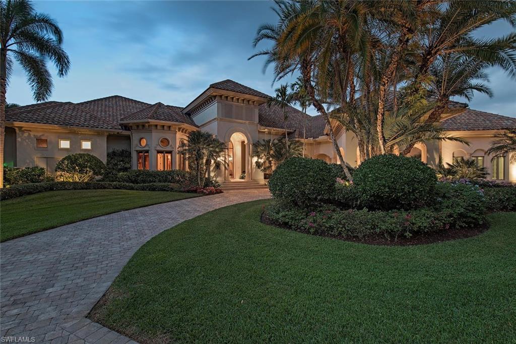 A masterpiece offering 4 beds+den/4.5 baths of exquisite detail. Distinctive home perfectly situated on a private cul-de-sac lot w/ circular driveway, side service entry, and panoramic golf course views. A breathtaking view of infinity edge pool & tropical landscaping beyond offers an alluring welcome when you enter the home. Architectural archways and columns lead you through a spanning floor plan of unparalleled finishes including travertine and wood flooring, custom wood cabinetry, granite counters, Pecky Cypress planked ceilings, & coved ceiling accents. Fully pocketing sliding glass doors bordering the main family room & gourmet kitchen generously give way to an expansive screened-in lanai where alfresco living comes to life w/ summer kitchen/gas grill, outdoor fireplace, massaging hot tub, gas & electric heated pool, & covered sitting areas. A meticulously appointed master suite includes spacious sitting area, morning kitchen, custom walk-in closet, his/hers vanities, Jacuzzi tub, & separate walk-in shower. Guest quarters & cabana afford every luxury w/ private balconies, ensuite baths, & spacious sitting areas to relax after a day of golf, sun, or surf.