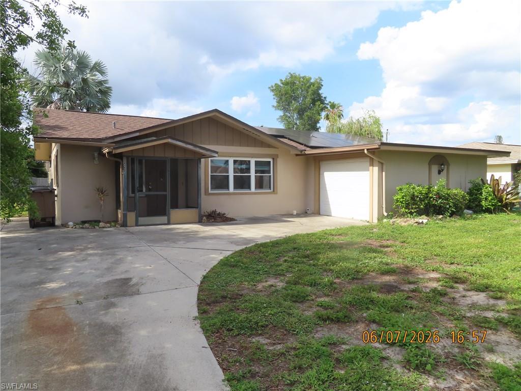 Welcome to your dream home at 521 SE 35th St, Cape Coral, FL! This charming 3-bedroom, 2-bathroom house offers 1,250 square feet of comfortable living space, perfect for families and entertaining. As you step inside, you'll be greeted by a bright and airy open floor plan that seamlessly connects the living area to the dining space, creating an inviting atmosphere for gatherings with loved ones. The well-appointed kitchen boasts ample storage and counter space, making meal preparation a delight. Step out to the lovely screened porch, where you can relax and enjoy the beautiful Florida weather while sipping your morning coffee or unwinding after a long day. The attached one-car garage provides convenience and additional storage options, while the dedicated laundry room is a practical touch that enhances everyday living.This home is just a short distance from local parks, shopping, and dining, ensuring you have everything you need right at your fingertips. Don’t miss the chance to make this delightful property your own and experience the vibrant lifestyle Cape Coral has to offer!