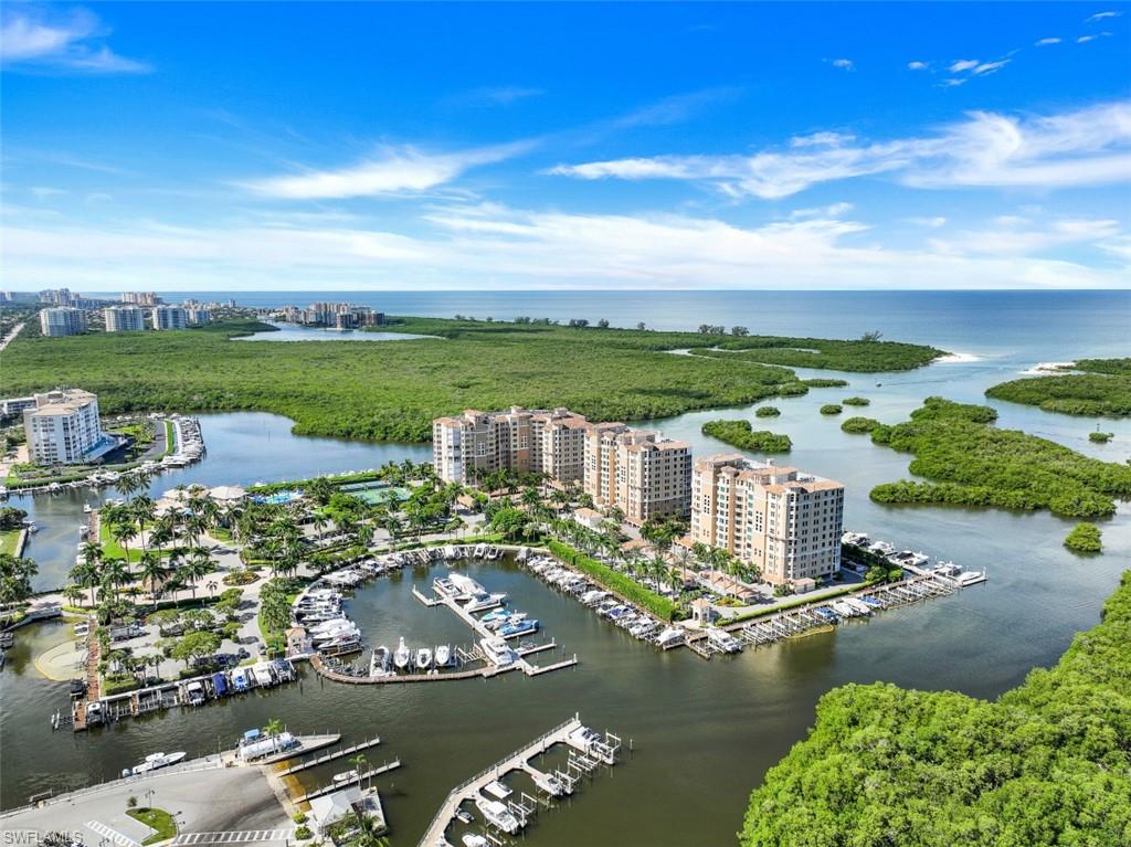 Beautiful Pelican Isle PH w/imposing views of Gulf of Mexico from west sunset lanai! East morning lanai off kitchen is perfect to see sun rise starting its daily roll toward the western horizon at sunset. Wow! A spacious kitchen suite, with priv. entrance, inc. lg. family rm/entertainment area, morning eat-in area, lg. laundry rm + big closet that could double as pantry. All cabinets & built-ins have pull out features for max storage capability. A favorite is a private office that could serve as Lg room, a special space! Main area highlights a full wall of impact glass sliders overlooking the Gulf. A stunning backdrop of this grand PH! Lovely formal bar area + storage rm. The intimate conversation area could also serve as gracious DR. The grand master suite overlooks the Gulf & opens to lanai. MBath suite has lg window over the Gulf - a personal sanctuary in your Naples retreat. Formal entrance to PH on north, opens to beautiful Gulf views. 2 exc. lg unsuits, plus smaller BR/office w/full 4th BR. Storage is abundant! 2 prime deeded parking spaces! Pelican Isle Yacht Club lifestyle features lovely amenities, amazing social gatherings, social functions & sports!  Separate membership.