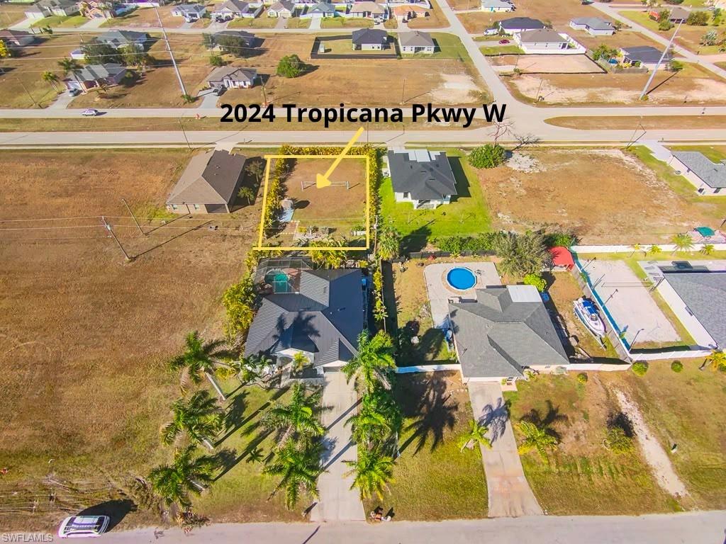 Don’t miss this unique opportunity! Own this vacant residential lot at 2024 Tropicana Pkwy, conveniently located near schools, a public library, gas stations, shopping, and other everyday amenities. The lot is located directly behind the home at 2025 NW 7th Ter, which is also currently available for sale separately.  Purchase the lot on its own, or take advantage of the opportunity to acquire both properties for additional space, privacy, and future possibilities