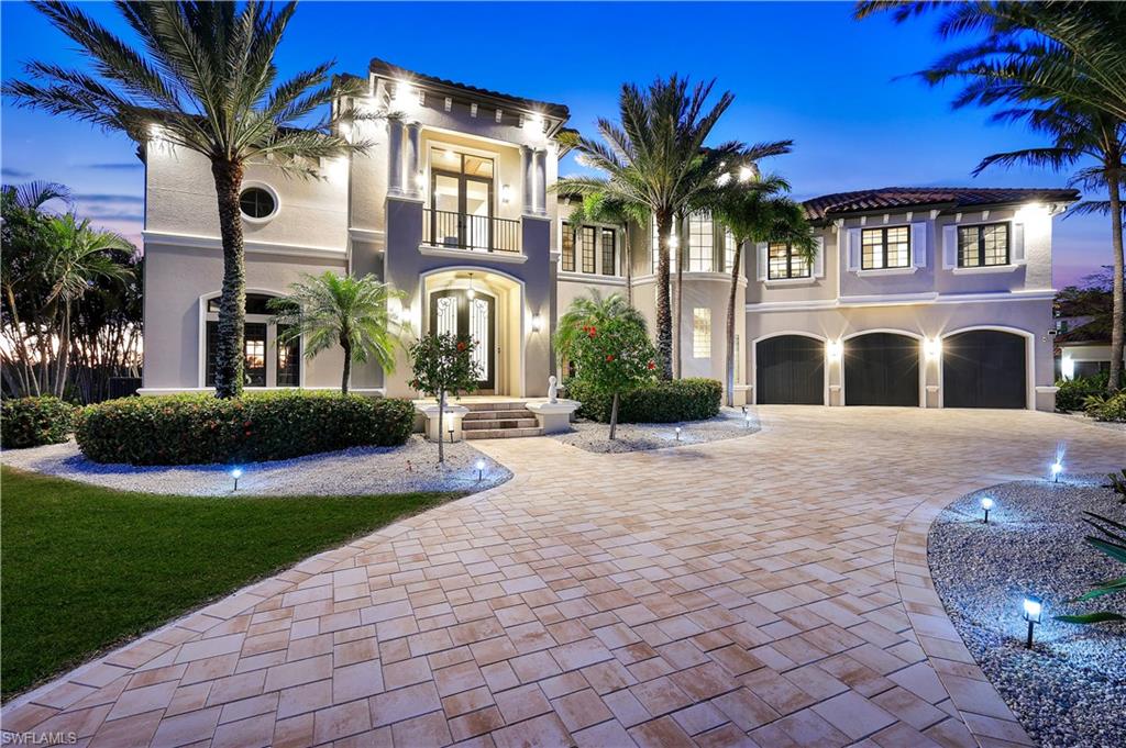 Unobstructed tropical waterfront views define this fully remodeled resort-style Gulf access estate overlooking the South Spreader Canal. Turnkey Furnished, this hurricane-proven residence was built and updated to endure Southwest Florida’s coastal environment while delivering exceptional luxury living. This breathtaking 6,308 sq ft waterfront masterpiece rests on a rare triple lot (.41 acres) with direct lock-free and bridge-free Gulf access, allowing effortless boating to the Caloosahatchee River and open Gulf waters. Western and Southwestern exposure provides panoramic sunset views across mangroves and preserve scenery that change nightly and must be experienced in person. Completely reimagined inside and out, virtually every component of the property has been upgraded. The renovation includes the kitchen, all bathrooms, interior living and entertainment spaces, custom swimming pool and spa, exterior decking, driveway, and new custom paver hardscapes surrounding the pool and outdoor areas. A grand arrival welcomes you with mature tropical palms, manicured landscaping, and an expansive paver driveway. Oversized double entry doors open into a dramatic two-story foyer with soaring 20+ foot ceilings and refined architectural detailing. The expansive great room showcases cathedral ceilings and walls of glass that frame wide water views and flood the home with natural light. The chef’s kitchen serves as the centerpiece of the home, featuring premium appliances, an oversized center island, walk-in pantry, and extensive custom cabinetry. It is designed equally for daily living and entertaining on a large scale. The primary suite offers a private waterfront retreat with tranquil canal views, a spa-inspired bath, and boutique-style custom walk-in closets. Each additional bedroom functions as a private suite with its own bath and private balcony overlooking the Spreader Canal and sunset skyline. Outdoor living rivals a private resort. A vanishing-edge infinity pool visually merges with the canal, accompanied by an oversized spa and waterfall feature. Expansive lounging and entertaining areas provide ideal spaces for sunset gatherings or quiet evenings along the water. Additional features include a private home theater, dedicated game room, formal and casual dining spaces, pre-wired surround sound, abundant storage, and an oversized three-car garage. The waterfront improvements include yacht-capable dockage plus a lift for additional watercraft. The lockless canal provides true unrestricted boating access to the river and Gulf. Located minutes from Cape Harbour and Tarpon Point marinas, waterfront dining, boutique shopping, and entertainment, this property delivers the ultimate Southwest Florida boating lifestyle, this exceptional waterfront estate represents outstanding value and a true luxury coastal residence. Existing transferable flood policy of approximately $1,400 per year, Reserve your private viewing today!