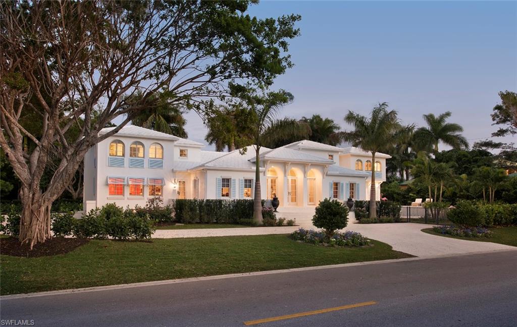 Multiple Sand Dollar and Aurora Award Winner! This Gulf Shore Blvd. South property is located steps to beautiful Naples beaches, and Old Naples dining and entertainment. This lovely home combines the charm of a French chateau with the beauty of the aqua blue waters of the nearby Gulf of Mexico.  A romantic triple arched entrance opens into a soaring parlor complimented by surrounding rooms each designed for entertaining. A stunning chef's kitchen has exemplary finishes, including Calcutta Gold marble countertops, Lacanche range, and an antique pastry table. An elegant formal dining room featuring designer specialties, a well-appointed family room, and a master suite opening onto a Travertine marble pool deck complete the first level.  This home also boasts a second level private master suite with a comfortable sitting area as well as a private sitting area centered between two delightful en-suite bedrooms. Unique wide plank oak flooring set a tone of comfort and style, while grand moldings and abundant coastal features add a stately ambience to this home. A unique driveway accents thoughtful plantings - Naples finest!