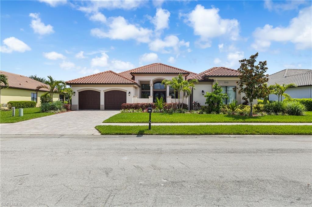 Welcome to elevated luxury living in the exclusive gated community of River Hall Country Club. Perfectly positioned on an oversized lakefront lot with sweeping views of the 7th hole, this custom estate home offers 3,854 square feet of refined living space, including 3 bedrooms plus a dedicated den/office, 3.5 bathrooms, and an oversized 3-car garage. From the moment you enter, 16-foot coffered ceilings in the great room create a grand sense of scale. Custom window treatments, and elegant finishes enhance the home’s timeless appeal. Architectural niches throughout the home are beautifully accented with hand-laid mica, adding a distinctive designer finish. A formal dining room with faux-painted walls and a designer crystal chandelier offers an elegant setting for intimate dinners and special gatherings. The chef’s kitchen is designed for both everyday living and effortless entertaining, featuring wood cabinetry with pull-out drawers, a new dual-fuel Wolf range, Sub-Zero refrigerator, wine cooler, wall oven and microwave combo, and a top-of-the-line Bosch dishwasher. The great room showcases custom sliding door treatments and a newly custom-built bar with hammered brass sink, brass faucet, and built-in ice maker, adding a sophisticated touch for hosting. The primary suite is a private retreat featuring wood floors, custom window treatments, professionally painted plaster feather wall detailing, and two spacious walk-in closets with built-in shelving. Step outside to an expansive screened lanai with a sparkling heated pool, spacious covered and open-air lounging areas, and panoramic lake and golf course views that create the ultimate Southwest Florida backdrop. The outdoor setting was further elevated in 2026 with all-new landscaping throughout the front, rear, and within the lanai, enhancing curb appeal, privacy, and the resort-style atmosphere surrounding the home. Whether enjoying morning coffee overlooking the water, relaxing poolside, or entertaining guests against the backdrop of the 7th hole, the outdoor living spaces are designed for year-round enjoyment. With too many upgrades to list, every selection in this residence was thoughtfully curated by professional decorators to create a true showstopper that blends luxury, comfort, and unforgettable style. Additional features include a whole-house generator with a 500-gallon underground propane tank and solar panels to help reduce electric costs. River Hall Country Club offers a championship 18-hole golf course designed by Davis Love III, along with resort-style amenities including a golf clubhouse and grille, lakeside pool and tiki bar restaurant, lagoon-style pool, full fitness center, tennis and pickleball courts, an in-community elementary school, and a new on-site fire station. Conveniently located near I-75, downtown Fort Myers, and Southwest Florida International Airport, this exceptional residence delivers luxury, lifestyle, and location in one remarkable offering.