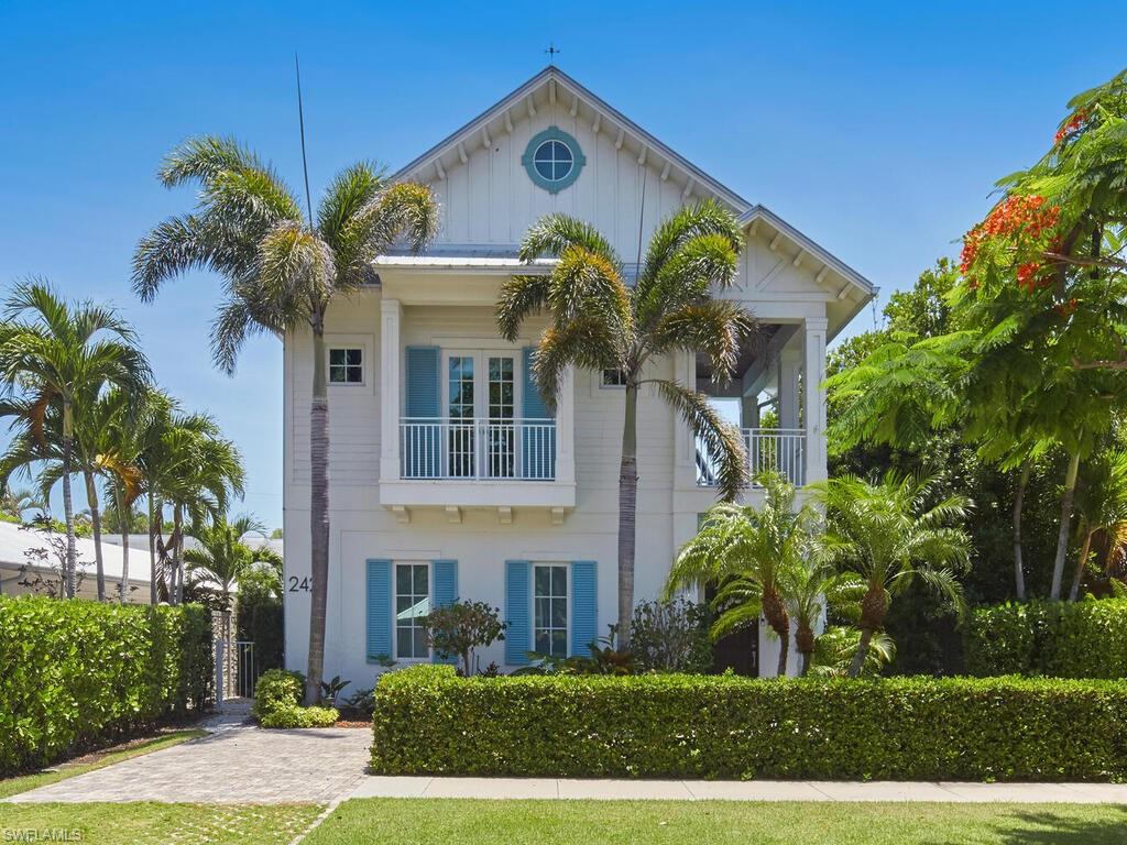 Location, luxury, and a nice street legal electric golf cart. Situated in the heart of Old Naples, this gem of a property sits high and dry, offering an exquisite balance of coastal elegance and peace of mind. Just moments from Naples' pristine Gulf beaches, the historic pier, and the world-class shopping and dining on 5th Ave S, and 3rd St S, this home is a rare find in one of the most desirable neighborhoods. Designed for seamless indoor-outdoor living, this 3,600+ sq. ft. home features an open-concept floor plan that effortlessly extends into a breathtaking courtyard retreat. Verdant gardens and tropical greenery surround a resort-inspired pool with captivating water features, a sunken spa, and a screened lanai, creating a private paradise perfect for relaxation and entertaining. Inside, every detail showcases masterful craftsmanship—from hand-selected natural wood floors and custom architectural ceilings to a sleek, modern chef’s kitchen that is as functional as it is striking. The expansive primary suite offers a spa-like bath and walk-in closets, while a luxurious guest suite with a private entrance and balcony provides an elegant escape. Elevating comfort and security, this home also boasts a temperature-controlled artisan glass wine wall, an elevator, a gas generator, impact-resistant windows and doors, and full natural gas. Unrivaled design. Unmatched location. This is more than a home—it’s a statement of Naples luxury, near the shimmering Gulf waters.