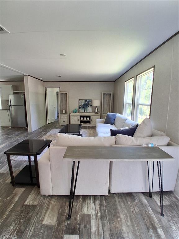Welcome to Montura Ranches in Woodland Subdivision. This is rural golf-cart and horse-friendly community with NO HOA's. Residents have access to the Community Clubhouse and Poolhouse at no charge. New construction includes a 1,493 sq ft 2024 DWMH Champion Model 26.8 x 56 with 3 bedrooms and 2 baths. All new septic, well and underground electric wiring sitting on 1.03 acre. Beautiful color modern scheme and trimming through the house with linoleum flooring. Stainless steel appliances for kitchen included. Property qualifies for USDA, FHA and VA lending. Enjoy the peaceful country farm life near the entrance of Montura Ranches, 20 min out of town and 1.5hr from each coast. This rural community is growing. This property is located close to Flaghole and out of Montura Ranches closer than most. Pay no city taxes and have a big yard for your toys such atvs, rvs, and multiple vehicles. Call to schedule your private showing today!