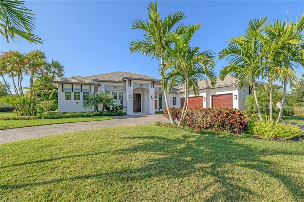 This STUNNING custom-built estate home by Divco is being sold FURNISHED and offers a spectacular view of the largest lake in Twin Eagles! This home boasts 4 en-suite bedrooms plus a powder room, den, and a Retreat room which may be used as an office, a fifth bedroom, or a game room. Also features a gourmet kitchen, dining room, fabulous engineered hardwood flooring, custom window treatments, impact windows and doors, a three-car garage, and a large lanai with an outdoor kitchen, fireplace, pool, and spa overlooking the large lake.  Twin Eagles has two Championship Golf Courses, a soon-to-be-built new clubhouse, tennis courts, fitness center, resort-style pool, and Tiki bar.  Full Golf membership is included with the purchase.