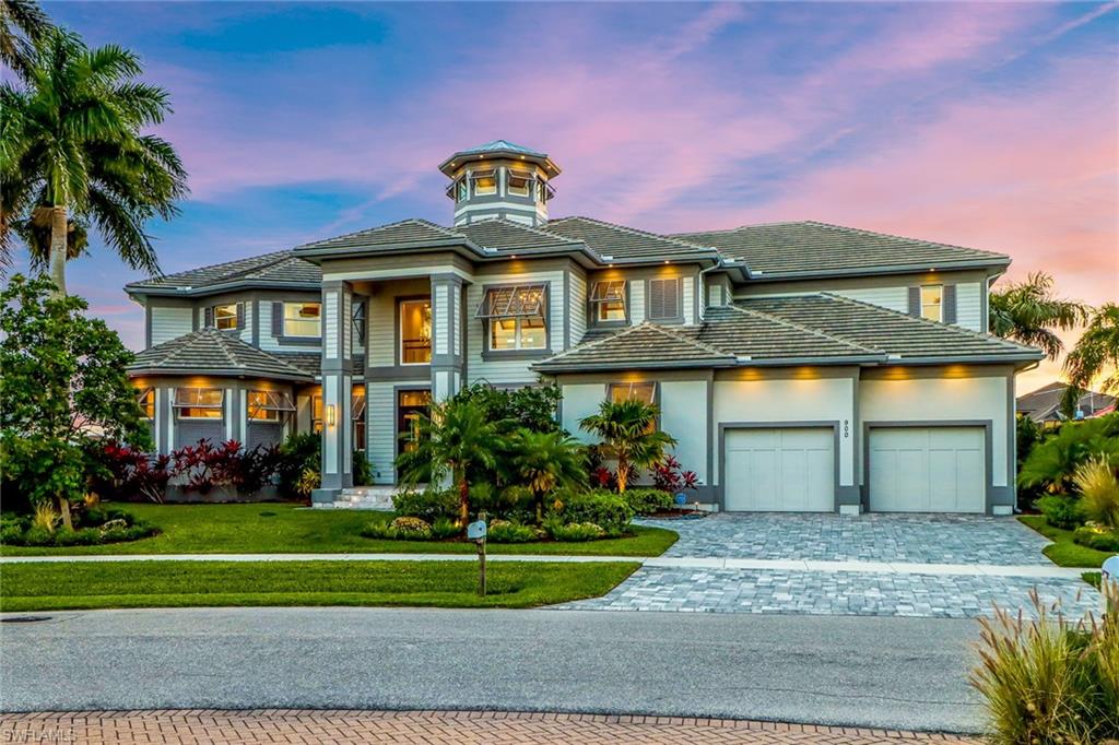 Not your standard canal view – Enjoy the expansive water views from this 6,337 Sq.Ft. (9,896 Sq.Ft. under roof) Six bedrooms, seven-bathroom residence. All bedrooms enjoy an en-suite bathroom, walk-in closet, water views, and direct access to a lanai. The kitchen features two Sub-Zero refrigerators, Wolf appliances, a pot-filler, and quartzite Taj Mahal leather finish countertops. The open concept floor plan features a 27’ ceiling in the great room that extends to 41’ at the peak of the Cupola. The second-floor media room opens up to a 1200 Sq.Ft. Second-floor lanai overlooking the pool and the bay. All floor levels are accessible by an elevator.  Over 150’ of waterfront and a dock that features a covered boat lift rated at 20,000 lbs and a double jet ski lift rated at 10,000 lbs. The three-stall garage also provides waterside entry for easy access to your kayaks or paddleboards.  Other features include: Outdoor kitchen, lush landscaping, pool with spa, Savant smart home, backup generator, electronic blinds and shutters, central vacuum, ceiling fans in every suite, and no carpet! If this home does not have it, you probably do not need it.