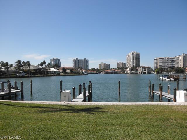 Enjoy spectacular bay views and panoramic views of Venetian Village in the heart of Park Shore.  This exquisite Park Shore residence has been completely renovated with over $ 200,000 in upgrades at builder cost. The home was stripped down to concrete & studs for this overhaul. Not like any other residence in Colony Gardens. Addition of upstairs laundry room, added steel support, enclosed lanai, all new kitchen & bath, all new electrical and plumbing.  3 bedroom townhome with a bedroom on the first floor. In addition the owner has paid off the $ 60,000 assessment to Colony Gardens for all their improvements including parking lot pavers, all new windows, new roof, exterior paint and upgraded community pool. The location and views can't be beat.