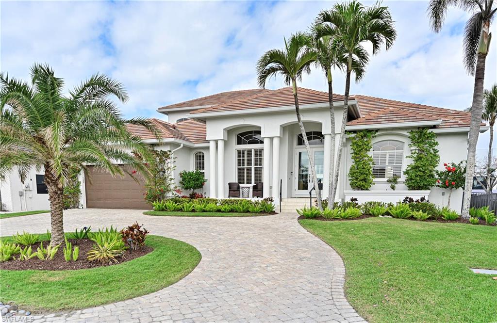 Located just a short walk from beautiful Vanderbilt Beach in Naples Florida, this stunning four-bedroom, three-bathroom home is a coastal gem that blends luxury, comfort, and convenience. Recently renovated, this residence boasts an array of modern upgrades that elevate its charm and functionality. The home features a bright, open concept living space where natural light pours in. Highlights include brand-new custom cabinetry in the gourmet kitchen including a large island, stainless steel appliances and quartz countertops. Designed with both style and practicality in mind, the kitchen is a chef’s dream, featuring ample storage and top-tier finishes. The home’s four spacious bedrooms offer flexibility and comfort, perfect for family living, or hosting guests, while also offering a den/office that can be used as a fifth bedroom. The three beautifully appointed bathrooms have been thoughtfully updated, offering a spa-like retreat with contemporary fixtures and elegant design. Outside, the property shines as a waterfront haven. A brand-new boat dock with a covered lift and double jet ski lift is paired with a newly constructed higher seawall that ensures peace of mind and enhanced protection. With direct Gulf access just a short, scenic ride to Wiggins Pass, this home is a boater’s paradise, offering effortless opportunities to explore the sparkling waters of Southwest Florida. The inviting covered and open outdoor lanai areas offers both sun and shade options next to the brand-new pool with an oversized integrated spa. Furniture is negotiable, allowing you to move in with ease and Seller is open to a quick or long closing date. The dedicated beach access is located directly across the street. For dining, shopping and entertainment, the upscale Mercato Shops, Waterside Shops annd Olde Naples are just minutes away, offering a vibrant mix of luxury boutiques, gourmet restaurants, and lively nightlife. This home sits up high and received no flooding in the recent two Hurricanes.