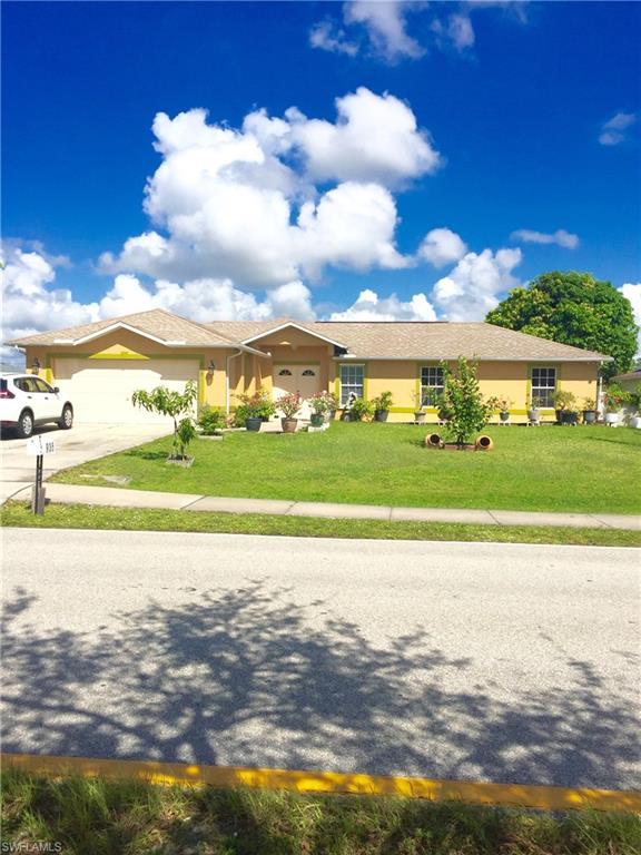 Beautiful Spacious Home with 4 Bedrooms, 3 Full Baths, 2 Car Garage in Desirable SW Cape Coral Area. Stroll up the Walkway Lined with Very Colorful Flowering Plants to the Front Double Doors into an Open Floor Plan with High Ceilings, Crown Molding & Tile Through-out Home! Kitchen has a Breakfast Bar with Door leading out to Screened-in Lanai. Large Master Bedroom has Walk-in Closet with Master Bath having Dual Sinks, Linen Closet & Shower. Home Features Split Bedrooms with Second Bedroom having its own Separate Door to Bathroom and Bathroom has Door to Backyard as well. Living/Dining Room has Sliders that lead to Lanai to Relax & Enjoy the Warm Breezes. Large Backyard With Lots of Fruit Trees which is Really Nice Plus Room for a Pool! This High Demand SW Area is Convenient to Shopping, Fine Dining, Rumrunners, Cape Harbour Marina & Much More.