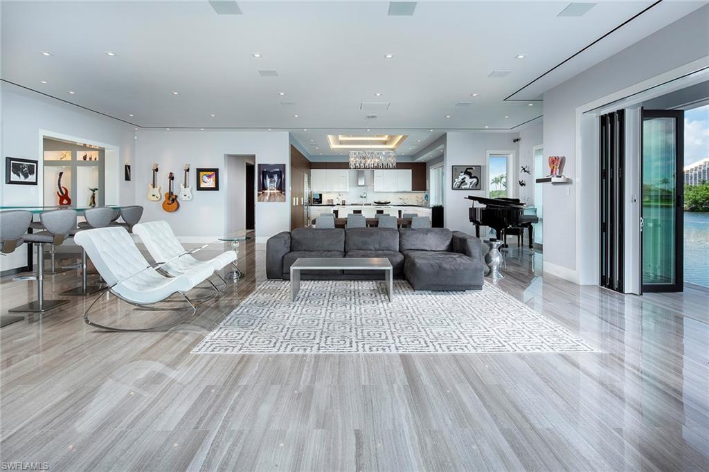 Completely redesigned from the ground up in 2013 and just steps away from your private, deeded beach access to the gorgeous glistening waters of the Gulf of Mexico. This coveted southeastern exposed home on the Venetian Bay is truly remarkable, sprawling on 115ft of water. Offering a sophisticated blend of coastal design and spectacular uninterrupted panoramic views. Custom details and extraordinary finishes are found throughout the four-bedroom plus a den, four-and-a-half-bath open floor plan. Showcasing imported limestone and marble flooring, full smart home capability from your phone, Quartz waterfall counters throughout and a gourmet kitchen, ideal for entertaining or just relaxing. This private setting awaits on an expansive outdoor oasis, providing the perfect tropical retreat. Only a 5 minute walk along the bay to the exclusive shopping and dining at the Venetian Village, this is your chance to own a piece of paradise. Watch our Video.