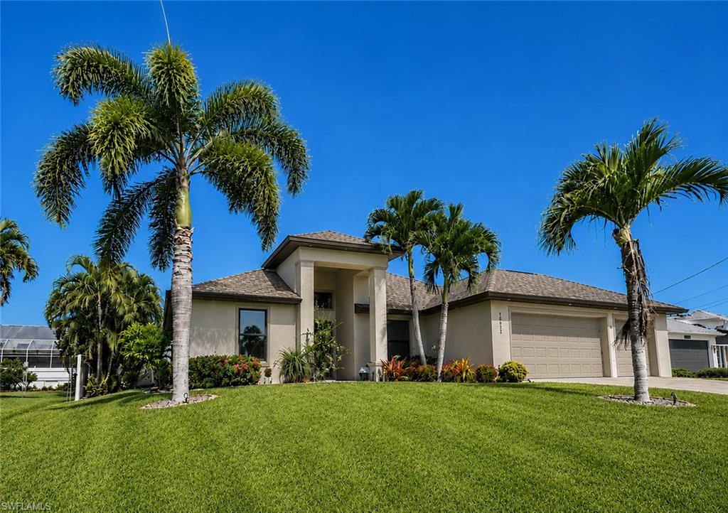 Welcome to this exceptional 3-bedroom, 3-bath pool home with a private den/office and spacious 3-car garage, ideally located in one of Cape Coral's most desirable neighborhoods west of Surfside Boulevard.

Built with Logix Insulated Concrete Forms (ICF), this residence offers one of the most durable and energy-efficient construction methods available today. Additional storm protection features include impact-resistant windows and doors, as well as electric Storm Smart screens on the lanai. The home successfully weathered recent hurricanes without damage, providing peace of mind for years to come.

The open-concept floor plan is designed for both everyday living and entertaining. The gourmet kitchen features a large center island, solid wood soft-close white cabinetry, granite countertops, updated stainless steel appliances, and modern fixtures. The spacious living room showcases tray ceilings with crown molding, recessed lighting, and pocket sliding glass doors that open to the outdoor living area.

The owner's suite is a private retreat with direct lanai access, dual walk-in closets, a large walk-in shower, and a double-sink vanity. Guest bedrooms are thoughtfully situated on the opposite side of the home, offering privacy along with a guest bath and convenient pool bath, for a total of three full bathrooms.

Beautiful porcelain tile flooring extends throughout the main living areas, while luxury vinyl flooring enhances the bedrooms. The front den/office features a full-glass door, making it ideal for remote work or a quiet study.

Step outside to the expansive screened lanai, which spans the entire width of the home. The heated pool is complemented by a paver deck, sun shelf, swim-out platform, Bubbler & Water Stream feature plus generous covered seating area, creating the perfect setting for entertaining or relaxing while enjoying breathtaking sunset views. Pavers continue along the side of the home to the driveway, adding to the property's impressive curb appeal.

The fenced backyard is beautifully landscaped with decorative curbing, mature plantings, and a 4-zone irrigation system. Additional highlights include remote-controlled ceiling fans throughout and a newer air conditioning with purifier system that is less than one year old.

Located in a highly sought-after neighborhood with city assessments paid in full, this meticulously maintained home combines quality construction, modern upgrades, and resort-style outdoor living. A truly outstanding opportunity in Southwest Florida.