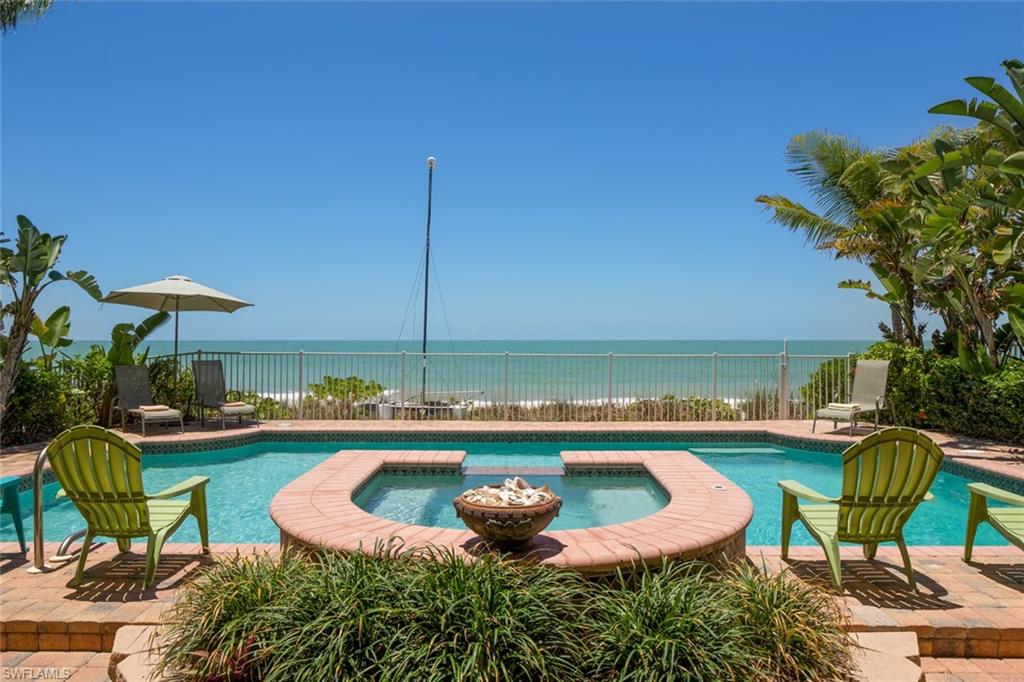 PRICED TO SELL!! HURRY!! Great massive built beachfront residence with newer added elevator, huge deep pool with spacious spa. No mangroves in front of this lot for unobstructed beach and Gulf views from the pool deck. Tropical added landscaping, fenced with gate. Storm shutters and impact doors throughout. Master suite has wonderful beachfront office/den. Laundry on each floor.