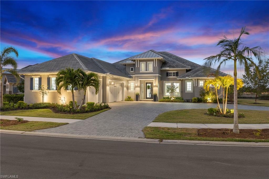 This exquisite Stock home (Covington III) is located on a premier end lot of a cul-de-sac, with a spacious circular drive. The interior is a masterpiece in blues and white, where detail will delight any discerning homeowner. Exuding luxury and refined elegance, this home’s open-concept design creates the ultimate space for entertainment by seamlessly connecting the living, dining, kitchen and outdoor areas. High-end finishes throughout and breathtaking long lake views bring the tranquil outdoors into every room. Retreat to the opulent primary bedroom featuring private access to the expansive covered lanai where you’ll enjoy the best of outdoor living, including an outdoor shower, living & dining areas and gourmet kitchen & bar with dishwasher & refrigerator. Beautiful travertine tiles extend to a gorgeous pool & spa and plenty of space to lounge in the sunshine. Special features include; whole house generator, solar and/or gas heated pool, electric storm screens, gas cooktops, custom pantry and more. The Isles of Collier Preserve is renowned for its natural beauty and exclusive amenities, offering residents a harmonious blend of luxury, nature. Mark 2024 by making paradise yours!