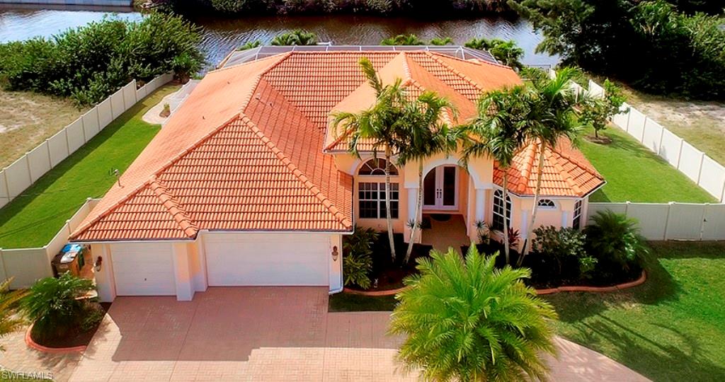 Still Showing! Under contract with 72 Hr Kickout Clause. Large custom home with 110 ft of waterfront on large 3-lot site with Gulf Access & south exposure.  2500+ sq ft with 2 master bedrooms (Use one for guests, teenager, or mother-in-law suite), and 4th bedrm/Private Office with French doors.  Large yard has plenty of room, unlike most waterfront homes, for pets, kids, & privacy. Large heated saltwater pool with spa (hot tub) overlooks water and dock. Home has many upscale features including surround sound system, architectural upgrades, whole house RO system, and hard-wired generator turns on automatically during power loss.  Lanai's custom wood bar stays or could be easily moved. Dock with lift has plenty of deck space to enjoy.  Outside there's beautiful landscaping, 6 ft privacy fence, and more.  Forget TV - There's plenty of nature to watch outside. Besides the beautiful water view, manatees and tropical birds frequent the area. And don't forget evenings on your dock or pool with gorgeous sunsets. AC system including ducts were replaced 2013 & has 5 UV lights for clean air. Many new appliances. Whole house has been lovingly maintained & Now available for your enjoyment.