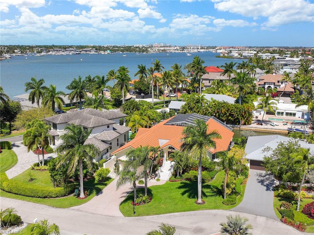 PRICED TO SELL! Here is your opportunity to get into the exclusive community of Royal Harbor. Live comfortably in this beautiful home forever or until you design a new one. The property is located in a prime Royal Harbor location, on a quiet cul de sac, with direct boat access to The Gulf of Mexico. It features an open concept with volume ceilings and large outdoor living space on a higher level than surrounding homes, creating privacy. The screen enclosed heated, saltwater pool overlooks the homes two boat lifts. All bathrooms and closets have been renovated. Don’t miss out! The possibilities are endless. AVAILABLE NOW!