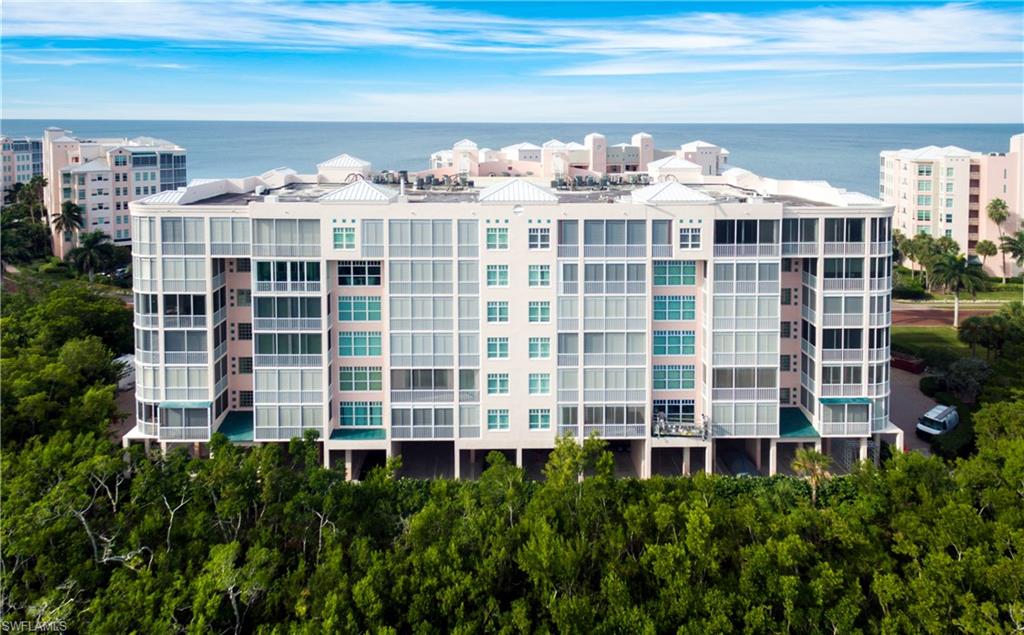 Lowest-priced condo available in all Barefoot Beach! An ultra-private oasis, just steps to the beach, with a peek of the Gulf from outside the front door. This 3-bedroom condo is bright, airy, and well-maintained with brand new neutral interior paint throughout the entire unit, upgraded porcelain tile, custom coastal contemporary lighting features, and both beautifully-updated baths. The master bath features a raised comfort height vanity, upgraded jetted tub, gorgeous frameless glass shower, new tile shower walls and floors, and custom recessed lighting with wall sconce accents. The kitchen includes stainless steel Samsung French Door refrigerator and double-sided stainless steel sink with reverse osmosis water system. Located just steps to a private beach boardwalk and two pools and spas exclusively servicing the residents of Barefoot Beach Club. Barefoot Beach is Collier's premier waterfront community and boasts 24-hour manned and gated entry, newly-pavered streets, three miles of sugar sand along the turquoise waters of the Gulf of Mexico, community pools and spas, & a perfect location near fine shopping and dining. *NOTE: PLEASE VIEW VIRTUAL TOUR FOR WALK THROUGH OF UNIT*