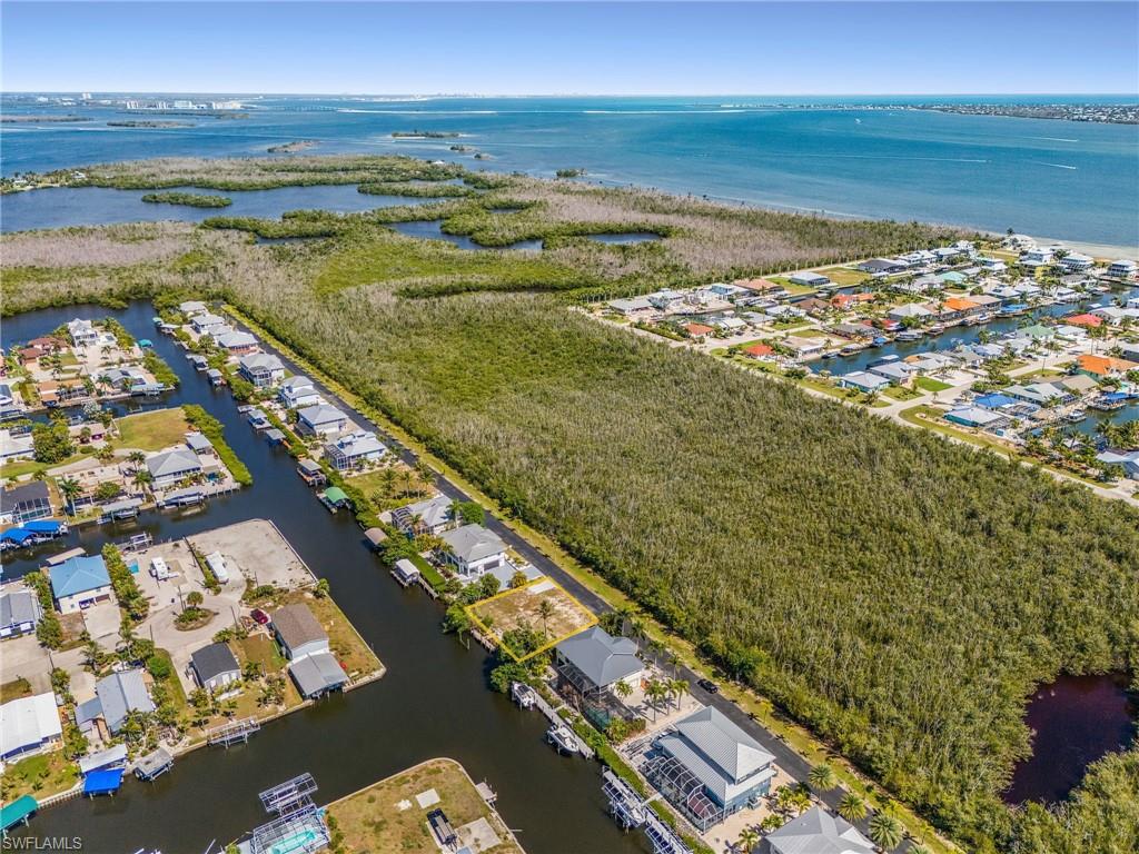 Rare opportunity to own a direct Gulf access homesite in a low-cost HOA community surrounded by beautiful upscale homes. Enjoy the confidence of investing in a well-maintained neighborhood while embracing the laid-back island lifestyle and conveniences of St. James City.
Build your dream home on one of Pine Island’s hidden gems and experience some of the very best boating and fishing Southwest Florida has to offer. With quick access to open water, you can spend your days exploring the islands and beaches of SWFL, enjoying world-class fishing, waterfront dining, and unforgettable sunsets right from your backyard. New pilings and dock/captains walk.