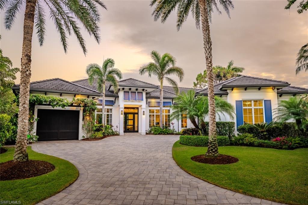Welcome to this exquisitely designed British West Indies home, where timeless elegance meets modern luxury. Nestled on a beautifully landscaped cul-de-sac in the heart of Pelican Bay, this residence offers a serene retreat with every contemporary comfort. As you step inside, you're greeted by an open and inviting floor plan that seamlessly integrates with the expansive, lush backyard. Here, you'll find a 45-foot resort-style pool and an infinity edge spa, surrounded by a spacious entertainment and dining area, perfect for gatherings. This outdoor oasis is enhanced by a cozy fire pit and an outdoor shower, all enjoying coveted Southern exposure. The chef's kitchen is a culinary masterpiece, featuring custom inset cabinetry, stunning quartzite counters, and top-of-the-line Wolf and Sub-Zero appliances, along with a built-in Miele coffee station for the perfect start to your day. This stunning home boasts four en-suite bedrooms, providing ample space and privacy for family and guests, along with a dedicated office and a custom wine bar. A 3-car garage offers convenience and additional storage. Throughout the home, you'll find French white oak flooring and superior quality finishes that elevate the ambiance of this luxurious lifestyle.
Living in Pelican Bay means enjoying unparalleled amenities, including two private beach clubs with miles of pristine white sandy beach, two exclusive restaurants, and complimentary chair and umbrella service. The community center offers a state-of-the-art fitness center, spa, and 18 Har-Tru tennis courts, ensuring an active and carefree lifestyle. Experience the best of Pelican Bay living in this exceptional home, where every detail has been carefully curated for your comfort and enjoyment. Carefree living at its finest awaits you!