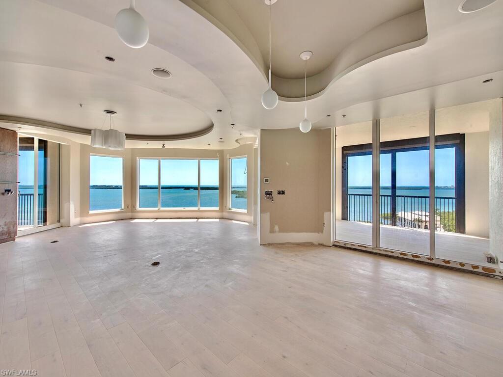 La Scala 10th floor premier 04 unit that is undergoing complete renovation, anticipated completion mid Sept.,2022.  Simply the best waterfront un-obstructed Bay and Gulf views in Bonita Springs.  While upgrade list is too extensive to detail, here are some highlights: new light oak floors in all rooms and porcelain tile in 5 baths. New interior solid core 4-panel doors along with new base, entirely new Kitchen with Wolf & Subzero appliances and quartz counters. Custom designed laundry, new master bath with floating tub & vanities and enormous shower, new LED lighting in all rooms. Private elevator lobby allows first glimpses of this fabulous sky home through custom glass doors. Great Room features walls of floor to ceiling glass windows and doors. 3 Large en-suite bedrooms plus den & total of 4.5 baths in nearly 4300 SF, well over 5,000 SF when you include 3 large lanais. La Scala owners enjoy two levels of amenities including: two story formal space, billiards room, theater, and library. The fitness center and pool/spa are luxury sized for only 64 owners. Feel secure with staffed front desk 24/7. Colony amenities: Bay Club dining, 34-acre island beach park and optional equity golf