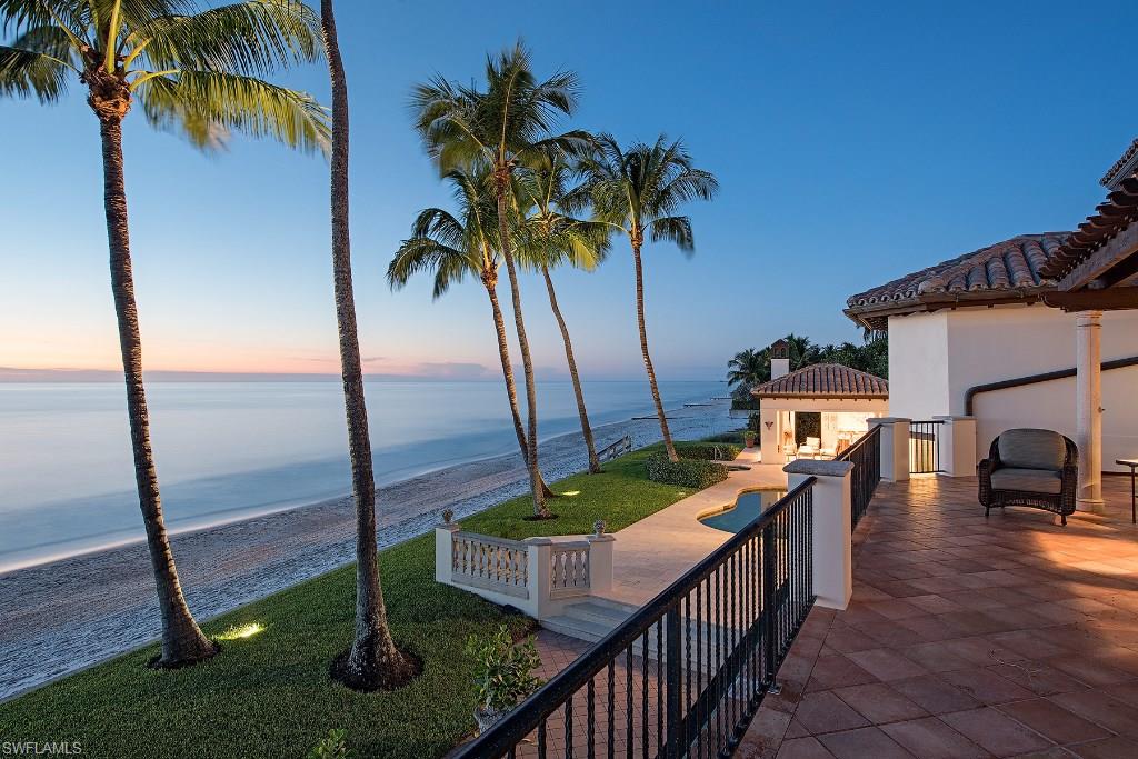 This property is one of the most impressive beachfront homes on the market today. Located on south Gordon Drive in exclusive Beach Estates, this rarely available property boasts over 150 feet of direct beach frontage with one of the most expansive views of the Gulf of Mexico. The Tuscan-inspired residence features pecky cypress ceilings, a floor-to-ceiling fireplace in the living room, two handcrafted wood staircases and bedrooms with Gulf views. The gourmet kitchen offers custom cabinetry and an eat-in dining area. Sunsets can be enjoyed from the cabana, pool and heated spa. Meticulous landscaping envelops the home's exterior. This exceptional property offers family and friends the ultimate Naples lifestyle. Includes Port Royal Club Associate Membership eligibility.