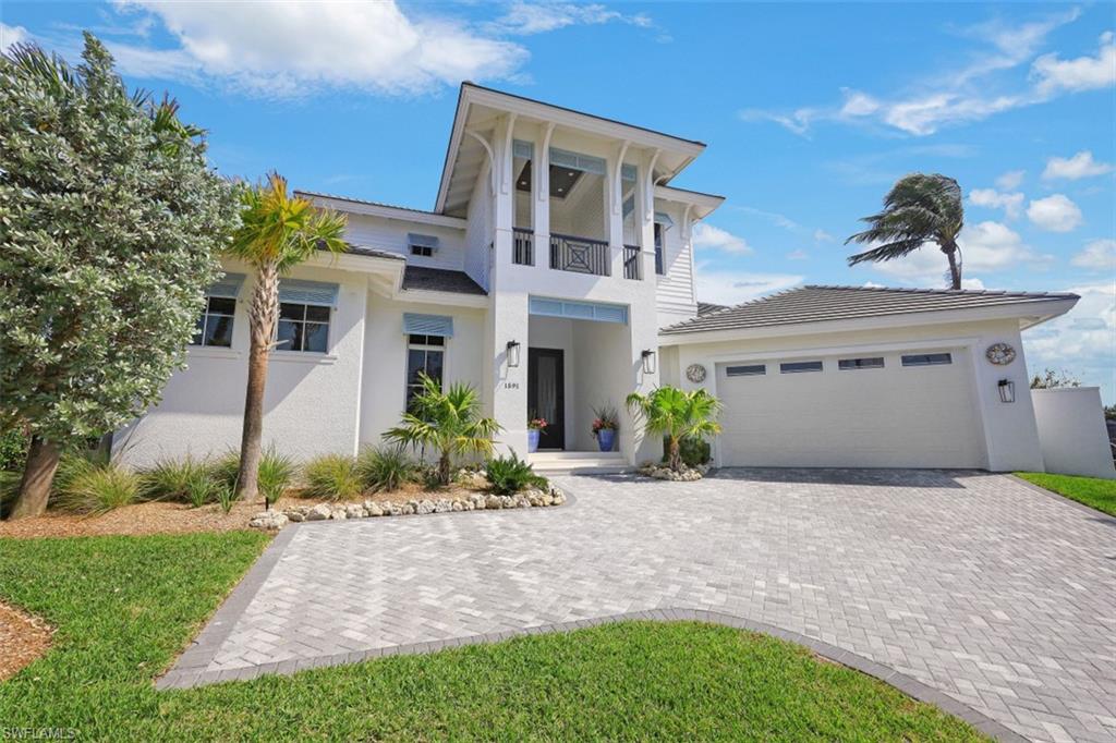 NEW home without the wait! This beauty was completed in 2021 for the current owners. Custom designed & built By Aqua Custom Homes to maximize the panoramic views afforded by the Tip lot location and 174 ft on the water. as you enter through the 10Ft tall Mahogany front doors your immediately greeted with wide water views!  White oak flooring throughout the first floor, Master suite with huge walk in closet with custom built ins (13 x11) spa like bath with walk in shower, separate tub, dual vanities. Guest suite, study, laundry, fantastic kitchen with walk in pantry! upgraded appliances and cabinetry. quartz counter tops, 18 seer Variable speed AC systems, with UV light and humidity control.whole house water filter & UV disinfection system, Somfy wireless electric roller shades and drapery panels, Seawall new in 2020. large covered lanai with roll down screens and shutters. outdoor kitchen, fire pit, gas lanterns! and so much more!  saltwater pool, new dock and lift. 2 more guest suites upstairs w/ a loft and balcony.. professionally decorated and furnished - nothing to do but bring your boat and enjoy the island life!
professionally designed, decorated and being sold furnished.