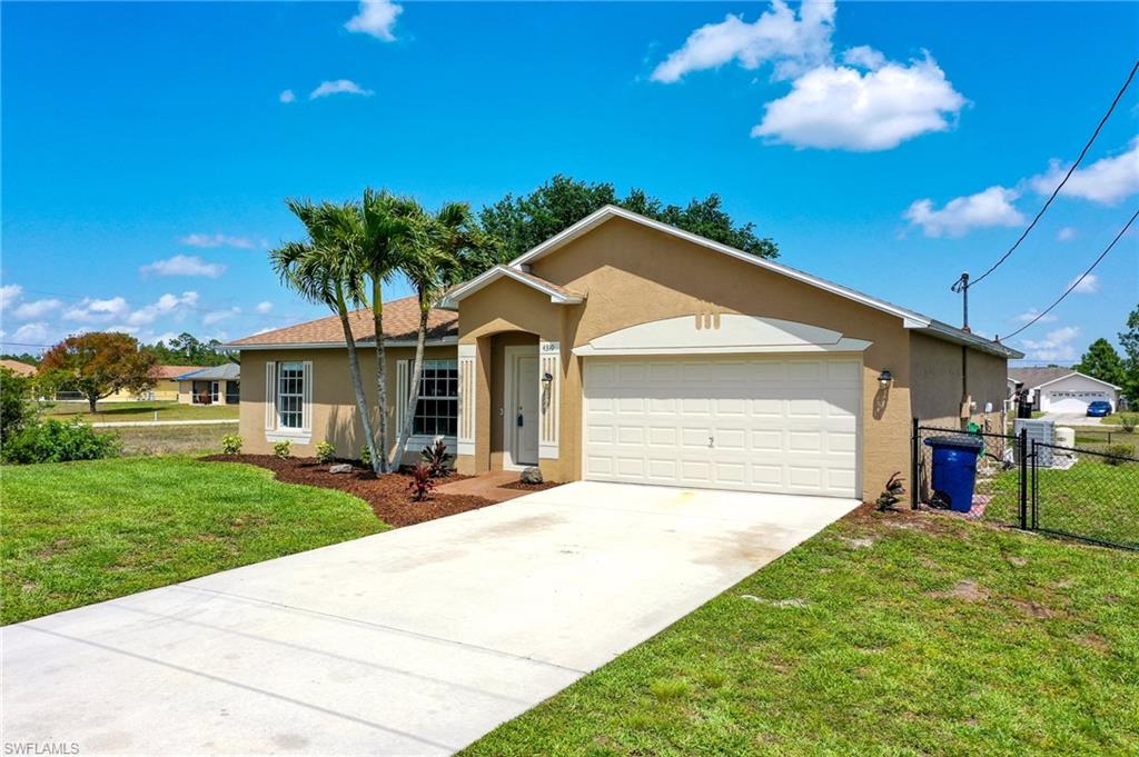 This Immaculate three bedroom, two bath, two car garage home in the desirable Lehigh Acres is completely remodeled and move-in ready! This well maintained home boasts spacious bedrooms and a large open living room and kitchen with Granite countertops and stainless steel appliances. Also a perfect under roof concrete patio in the rear to enjoy the large fenced in backyard. Recent updates include fresh paint, tile floors, updated bathrooms, high-efficiency A/C unit installed in 2022, new roof in 2019, new water system and how water heater in 2022, stainless steel appliances new in 2020 and washer and dryer new in 2020. This convenient location offers a great opportunity for your kids to walk to school or the library and is minutes from the international airport, restaurants, shopping and just a short drive to near by beaches.