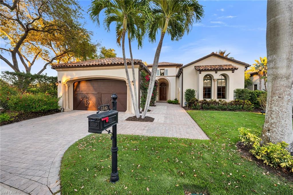 Welcome to this spectacular residence in the Estuary of Grey Oaks, with amazing updates and spectacular views of the 18th green and the Estuary Clubhouse, you truly will feel like you live in paradise. This residence has had a complete transformation of the main living areas as well as the exterior lanai and pool area.  From the moment you step inside, you’ll be greeted by expansive 30” x 30” porcelain floors, custom lighting, and a seamless open concept floor plan, achieved by removing columns and walls for a spacious and airy atmosphere. The home boasts a spectacular gourmet kitchen featuring Perla Venata quartzite counters, new lighting, open concept with spectacular view with a custom bar in the morning room, equipped with wine refrigerator, quartzite counters and abundant storage. The kitchen flows effortlessly into the great room, which is complete with unique ceiling details, custom entertainment built-ins, and a state-of-the-art Control 4 audio system throughout the home. This home offers incredible indoor-outdoor living. Step outside to a completely redesigned summer kitchen, marble shell stone deck floors, pool, and spa, where you can enjoy al fresco dining while soaking in the breathtaking views of the golf course and Estuary Clubhouse, through a picture-window screen. The outdoor space truly feels like a private resort villa, perfect for both entertaining and relaxing. Just imagine the fun conversations around the fire table, enjoying your favorite aperitif!
The large, luxurious primary suite is a sanctuary in itself, featuring two full baths, two walk-in closets, and an additional morning bar, where you can enjoy your first cup of coffee or tea while getting ready! The oversized study, with custom built-in desks and bespoke cabinetry, serves as a versatile space that can function as an office, den, or yoga/exercise room, but could also be converted into a fourth bedroom with ease, given its proximity to the half bath. This home offers several unique advantages that set it apart, including a whole-house generator, whole-house water filtration system, maintenance-free, transferable warranty, subterranean pest control stations, tankless water heater, and installed gutters and downspouts, buried underground. The attached, epoxy-floor, two-car garage also accommodates an additional golf cart. 
Grey Oaks has amazing amenities, including a 30,000 sq. ft. Wellness Center and Spa, resort pool, three golf courses, two clubhouses, three restaurants, a new pickleball center, bocce courts, tennis facilities, and a vibrant social scene. Ideally located just minutes from Naples’ pristine beaches, downtown, shopping, and dining, this home offers the perfect balance of luxury, comfort, and convenience.
Whether you’re hosting guests or enjoying a quiet evening in, this home is the ultimate expression of luxury living. Welcome to Grey Oaks!