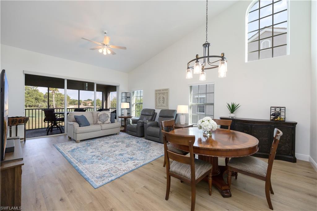 Enjoy gorgeous Golf Course and Water views from this light-filled, end unit, second-floor residence featuring 2 Bedrooms plus a Den, soaring ceilings, abundant storage, and a single-car Garage. The beautifully renovated Kitchen (2022) showcases custom cabinetry, updated appliances, and a clean, contemporary design that opens seamlessly to the living and dining areas. Luxury vinyl flooring (2022) extends throughout the main living spaces, complemented by tile in the bathrooms for easy maintenance. Hurricane-impact windows (2023) provide peace of mind while filling the home with natural light. The spacious split-bedroom floor plan offers privacy for owners and guests, making this residence ideal for both year-round living and seasonal enjoyment. Other recent improvements include NEW wash/dryer, toilets, fans, smoke alarms, window blinds, and garage door motor. With great attention to detail, the residence is a  perfect blend of style, comfort, and scenic views.  If you want to socialize or take a dip in the pool without going to the Club, Feather Sound has its own private pool and Clubhouse/Social Room just a short walk away.  The Strand is conveniently located to the Gulf with  miles of sugar sand beaches, Waterside & Mercato for dining/shopping, and RSW Airport.  Club Social Membership is required for all Strand homeowners but with NO initiation fee.  A Social Membership allows  family members full use of all amenities (except golf privileges).  The resort style Clubhouse offers tennis, pickle ball, bocce ball, croquet, salt water lap pool, fitness center, indoor and outdoor dining with no food or beverage minimum required.  Golf membership available separately.