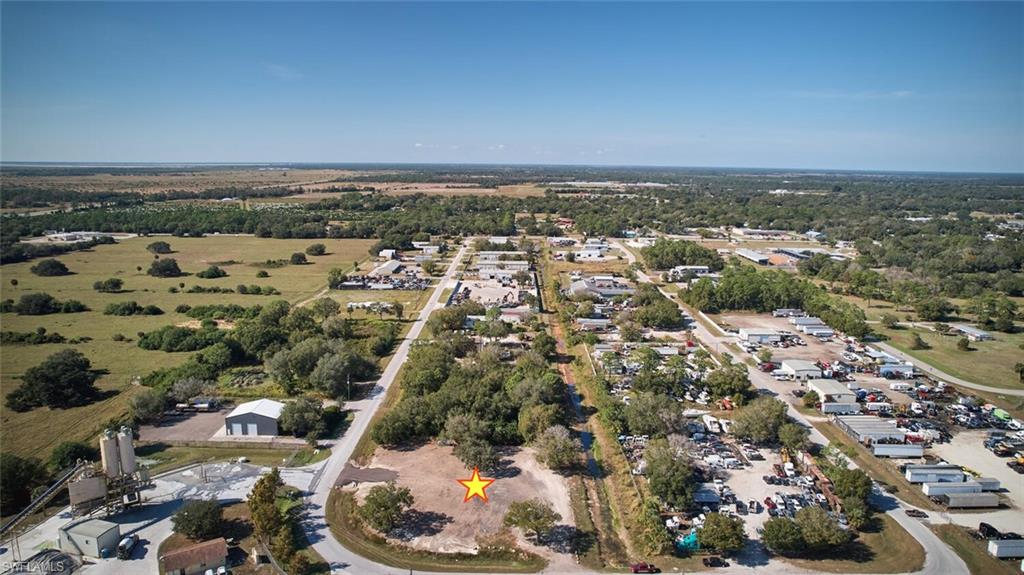 Prime 1.08± Acre Heavy Industrial Lot Near LaBelle Airport
Position your business for success with this Heavy Industrial parcel located on Industrial Loop in the growing community of LaBelle. Zoned I-2 Heavy Industrial, this property offers a wide array of permitted uses—ideal for manufacturing, logistics, storage, and other commercial operations. With over 400 feet of paved road frontage and a depth exceeding 200 feet, the site provides ample space and excellent visibility for your next project.

The property has been recently cleared, elevated, and improved, including the installation of an additional culvert to create a second oversized entrance. This dual-access layout allows large trucks and trailers to enter and exit easily without the need to turn around—perfect for high-traffic industrial activity. Electric service pole installed for easy hook up! 

Situated just outside LaBelle city limits, the property offers convenient access to local amenities without city taxes. The lot is surrounded by active industrial and commercial businesses and is only a stone’s throw from LaBelle Airport. It is also within walking distance of Highway 29 and just minutes from Highway 80, providing excellent regional connectivity.

LaBelle is experiencing rapid growth, making now an ideal time to invest. This central Southwest Florida location places you approximately 20 miles from Fort Myers, 1.5 hours from Florida’s east coast, 2 hours from Miami, and about 2.5 hours from Orlando and Tampa.

Don’t miss this rare opportunity to secure a strategic, high-visibility industrial site in one of Southwest Florida’s fastest-growing markets!