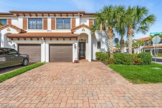 RARE END UNIT | ONE OF THE LARGEST FLOOR PLANS IN VILLA MEDICI | UPDATED PRIMARY BATH | HUGE LOFT & BONUS ROOM! Opportunities like this don't come along often. This highly sought-after BRIZA model offers one of the largest layouts in the community and is a rare end-unit that provides additional privacy, abundant natural light, and exceptional living space.

From the moment you enter, you'll appreciate the bright, open-concept design with soaring ceilings and an inviting living area that flows seamlessly into the dining room—perfect for entertaining or everyday living. Large windows fill the home with natural light, creating a warm and welcoming atmosphere throughout.

The beautifully designed kitchen features new stainless steel appliances, generous cabinet and counter space, and a convenient breakfast bar, making it ideal for everything from casual breakfasts to hosting family gatherings.

The spacious first-floor primary suite offers a peaceful retreat with a large walk-in closet and a completely updated spa-inspired bathroom featuring elegant quartz countertops, dual vanities, a soaking tub, and a stunning frameless glass walk-in shower. 

Step outside to your private screened lanai, the perfect place to enjoy your morning coffee or unwind after a long day.

Upstairs is where this home truly shines. Unlike many townhomes in the community, this property features an expansive loft and an oversized bonus room—providing exceptional flexibility for a media room, game room, family room, home office, fitness space, children's playroom, or even a potential fourth bedroom. Two generously sized guest bedrooms and a full bathroom complete the second floor.

Villa Medici residents enjoy resort-style amenities including a community pool, fitness center, cable, water, and beautifully maintained grounds. Ideally located in the heart of Fort Myers, you're just minutes from shopping, restaurants, medical facilities, entertainment, and the beautiful Gulf beaches.

Schedule your private showing today before this exceptional opportunity is gone!