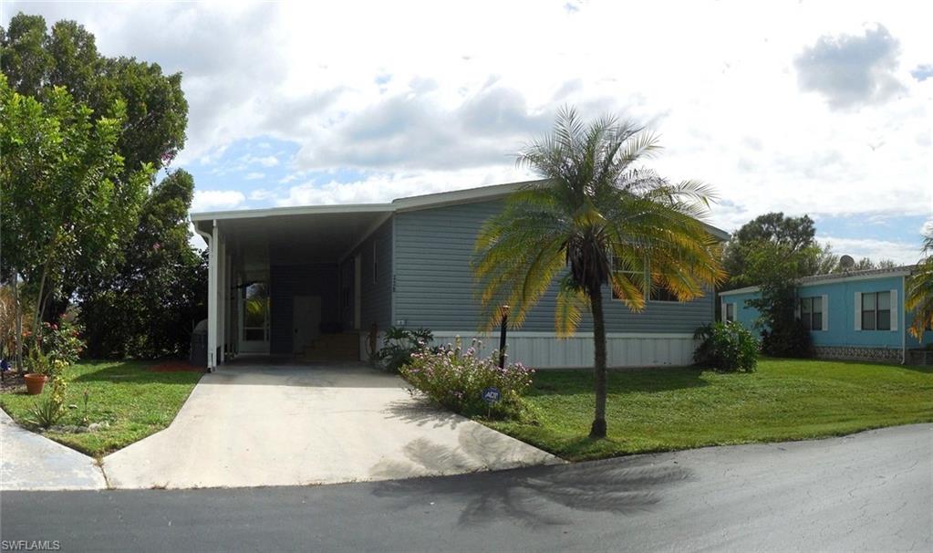Absolutely beautiful 3 BR, 2 BA manufactured home located in a charming family community! Wonderful open split floor plan with wood laminate flooring throughout the main living areas. Fantastic open kitchen offers lots of nice deep rich cabinetry, center cabinetry, counter bar and spacious pantry. Master bedroom offers a huge walk-in closet and luxurious master bathroom with large soaking tub and ceramic tile walk-in shower with 2 side shower heads and an overhead rain spout. Walk-in closets and wood laminate flooring in the 2nd and 3rd bedrooms. Large laundry room in the home. Private screened lanai and a great location within the community, close to the community pool. Quail Roost is conveniently located in South Naples close to shopping, restaurants, and just a short drive to Marco Island and Naples beaches! Chandelier in 3rd bedroom not included.