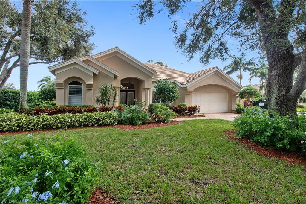 Beautiful low maintenance pool home boasts an eastern exposure on oversized lot surrounded by lush landscaping, ideal setting for enjoying your morning coffee. Home features wonderful upgrades & improvements. The tile roof is only 18 months old, kitchen remodel to include top of the line granite counters, replaced maple cabinets with stainless  appliances,     serving breakfast bar & added pantry. Sliding doors invite the outdoors in & a panoramic window was  added in family room to further enhance your pool view. Tile and laminated Oak wood flooring throughout the 3 bdrms, formal dining & two living areas the home offers. Private master suite with two walk-in closets & bath--beautiful granite countertop, dual sinks, jetted deep soaking tub & tiled spacious glass shower. Three full baths- each updated with tile, granite, mirrors, cabinetry, & lighting . Quality touches abound in this home, situated in the charming and well-manicured  neighborhood of Erin Lake with only 27 homes, the private location is unsurpassed and convenient to all that Naples has to offer.