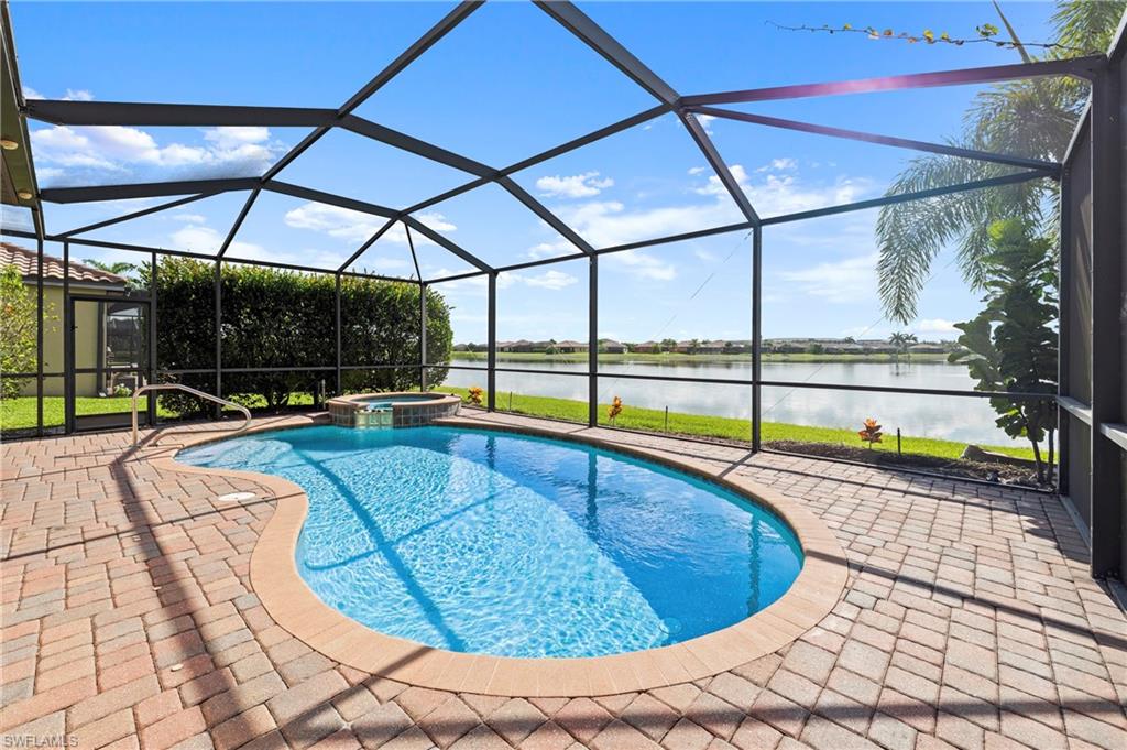 One or more photo(s) has been virtually staged, AI generated or rendered.  One or more photo(s) has been virtually staged, AI generated or rendered. Beautiful lake views, a heated saltwater pool and spa, and a highly convenient gated Fort Myers location — welcome to 2769 Via Piazza Loop in Promenade West at The Forum. This beautifully maintained single-family 3-bedroom, 2-bath home delivers the Southwest Florida lifestyle buyers are searching for, with a private screened lanai, sparkling pool and spa, and peaceful lakefront backdrop designed for year-round relaxation and entertaining. From the moment you step outside, the setting is the highlight. The expansive lanai overlooks a beautiful lake view, creating a serene outdoor retreat perfect for morning coffee, evening cocktails, weekend gatherings, or simply enjoying the privacy and calm of waterfront living. The heated saltwater pool and spa offer the ideal resort-style experience at home, with plenty of covered and uncovered space to lounge, dine, and enjoy the Florida sunshine. Inside, the home features an open and comfortable layout with granite countertops, stainless steel appliances, tile flooring throughout, and no carpet. The living spaces flow easily to the outdoor area, making the home feel bright, functional, and connected to the lake and pool views. Additional features include roll-down hurricane shutters, dual UV light HVAC filtration, an insulated 2-car garage with storage, tile roof, and block construction. Located in FEMA Zone X, the seller reports no hurricane damage. Promenade West at The Forum is a gated, pet-friendly community offering convenient access to I-75, shopping, dining, downtown Fort Myers, RSW International Airport, and everyday conveniences. This is not your typical Fort Myers listing — it offers the combination buyers want most: a move-in ready single-family home, peaceful lakefront views, a private heated saltwater pool and spa, and an exceptional location close to everything.